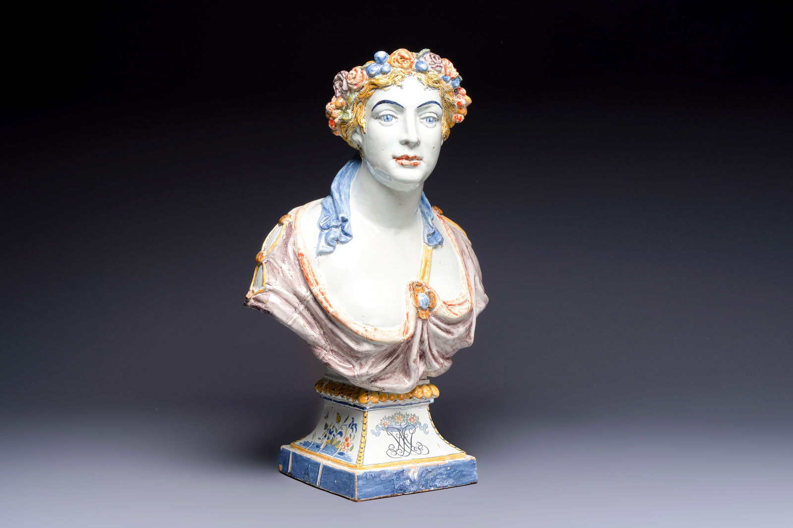 A large polychrome French faience monogrammed bust of a woman emblematic of spring, probably Rouen, (1 of 7)