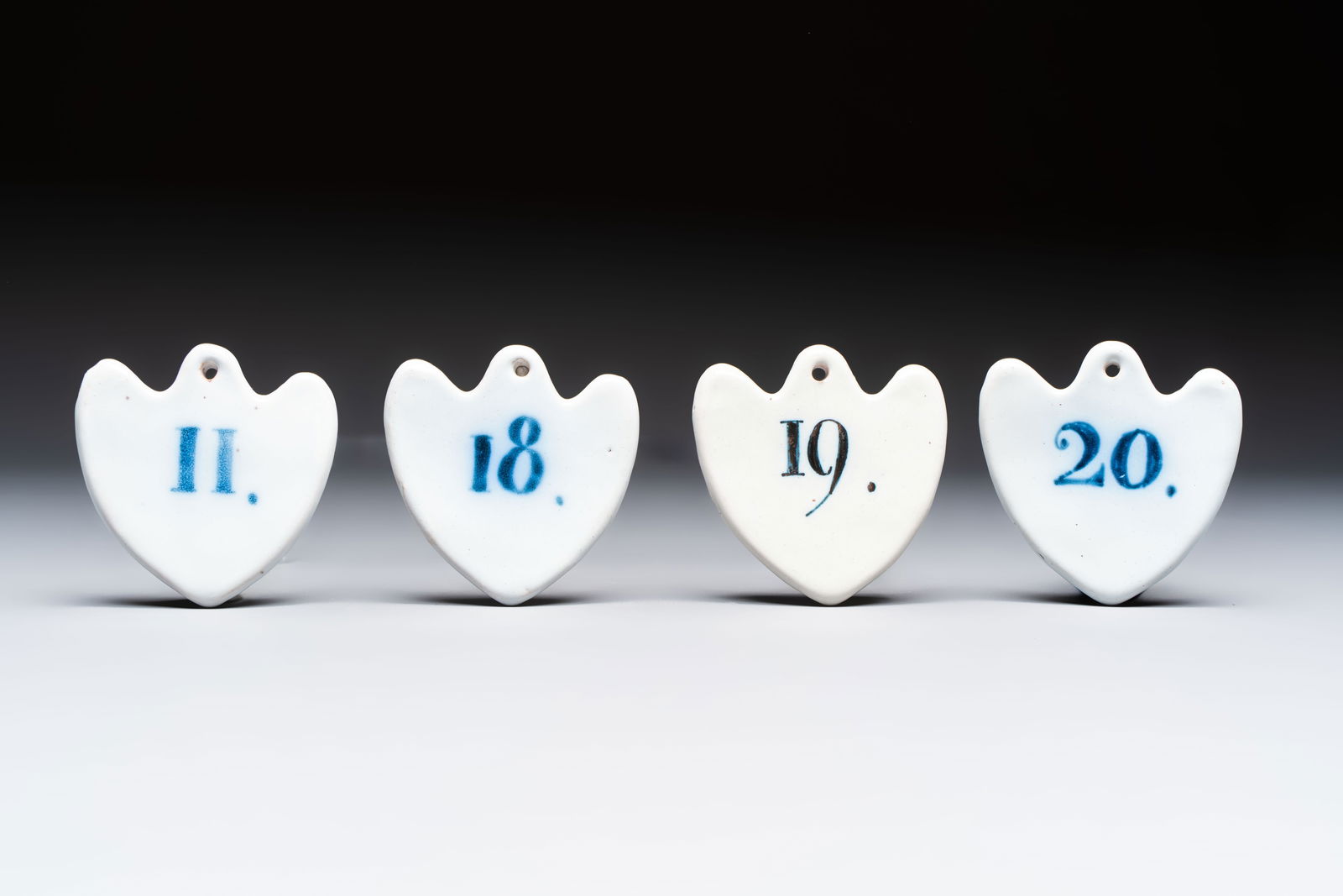 Four blue and white French faience numbered tags for wine barrels, probably Nevers, 18th C.: Four blue and white French faience numbered tags for wine barrels, probably Nevers, 18th C. Dim.: 8,7 x 8,7 cm