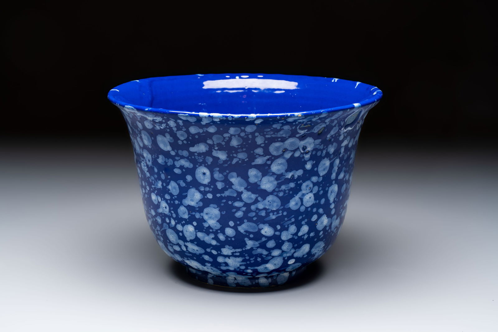 A Nevers white-splashed blue-ground 'à la bougie' bowl, France, late 17th C. (1 of 7)