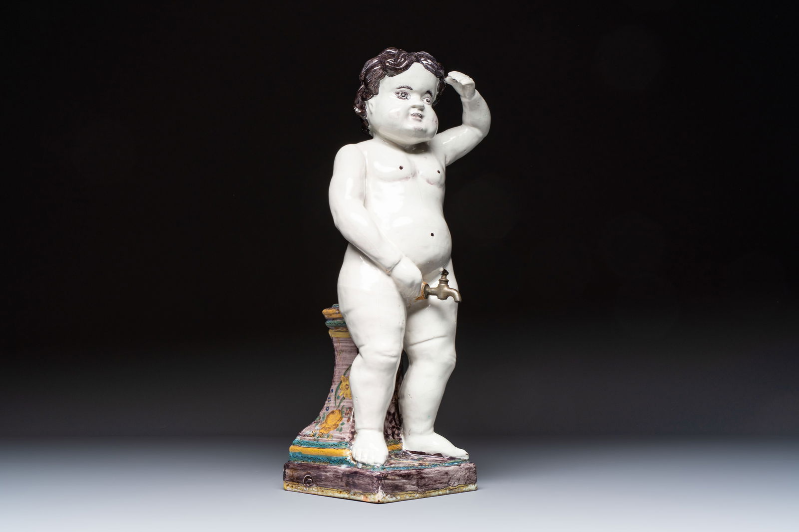 A rare large polychrome Brussels faience 'Manneken Pis' fountain with pewter tap, 18th C. (1 of 9)