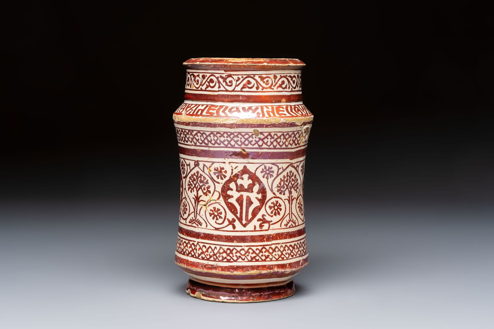 A very early Hispano-Moresque lustreware albarello, first half 15th C.: A very early Hispano-Moresque lustreware albarello, first half 15th C. H.: 20 cm Provenance: A French private collection. Ref.: The Metropolitan Museum, New York, object number 56.171.81 for an identi