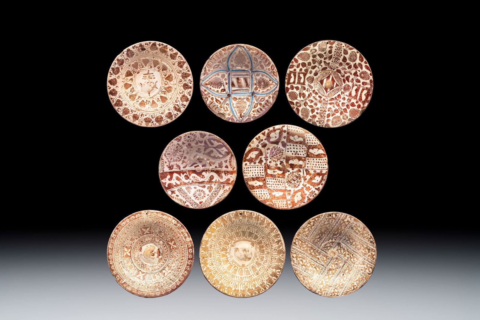 A very unusual collection of eight Hispano-Moresque lustreware plates, Spain, 16th C. (1 of 9)