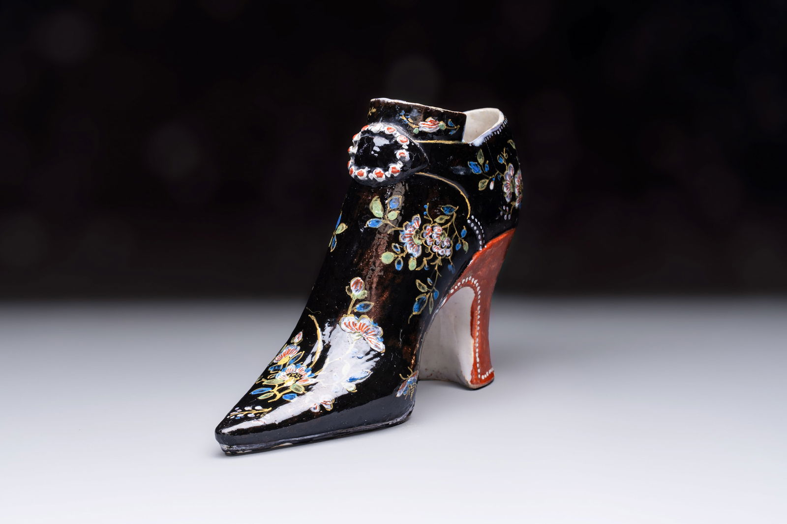 An extremely rare black Delftware model of a shoe, early 18th C. (1 of 7)