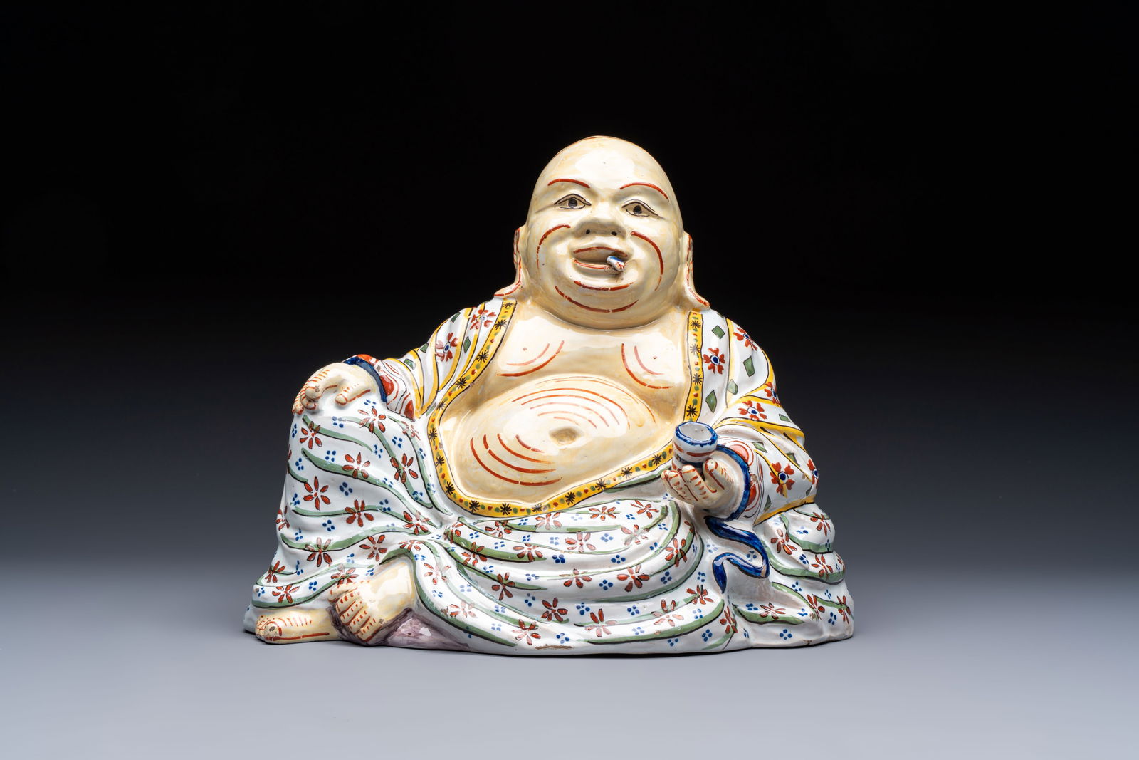 A polychrome Dutch Delft 'Budai' figure, 19th C. (1 of 6)
