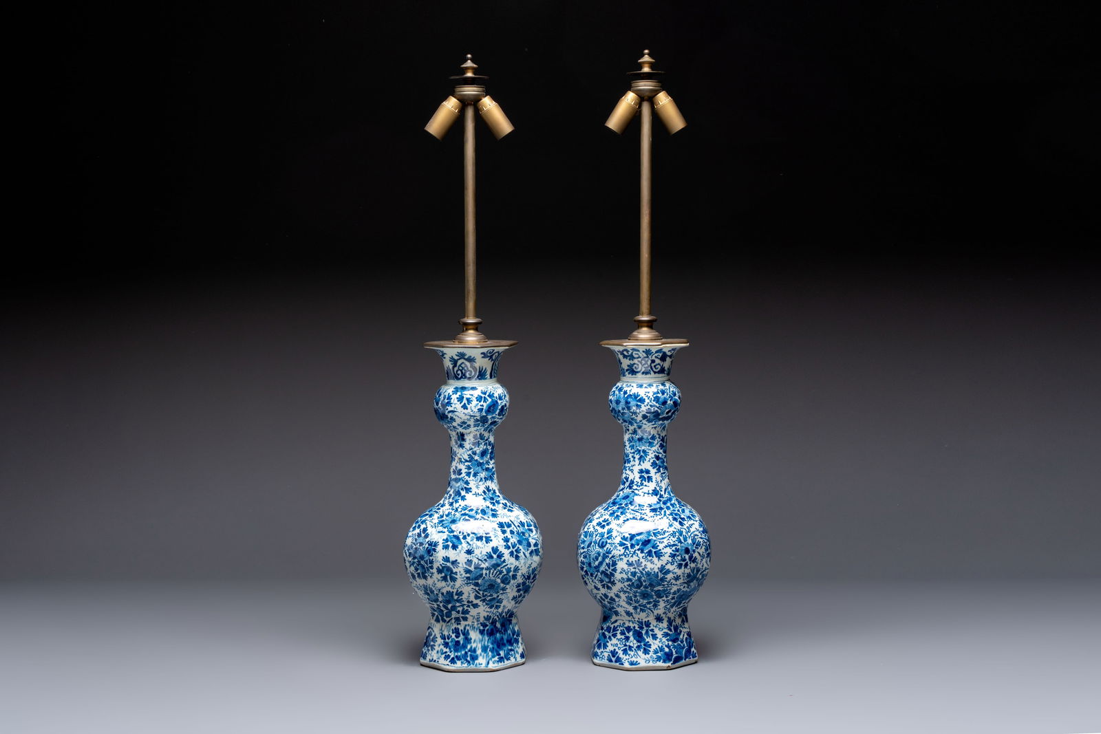 A pair of blue and white Dutch Delft garlic-head vases mounted as lamps, 18th C. (1 of 6)