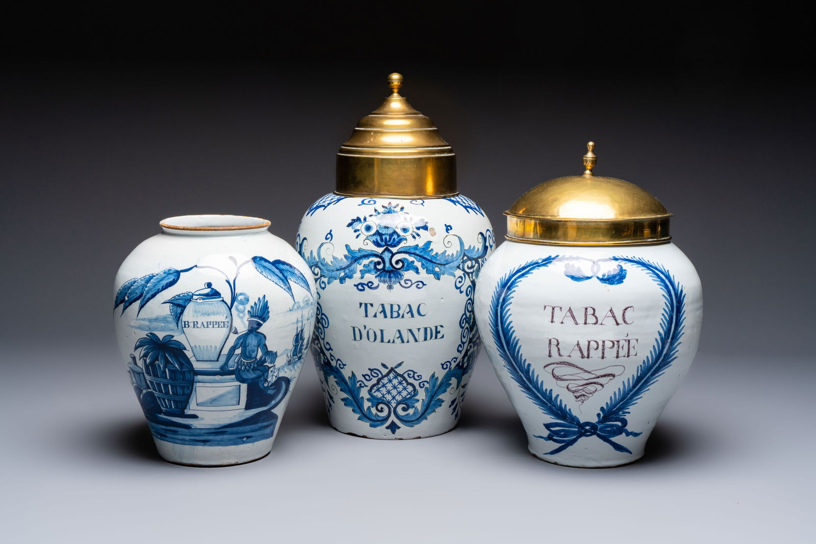 A blue and white Dutch Delft tobacco jar and two French tobacco jars with brass lids, 18/19th C. (1 of 9)