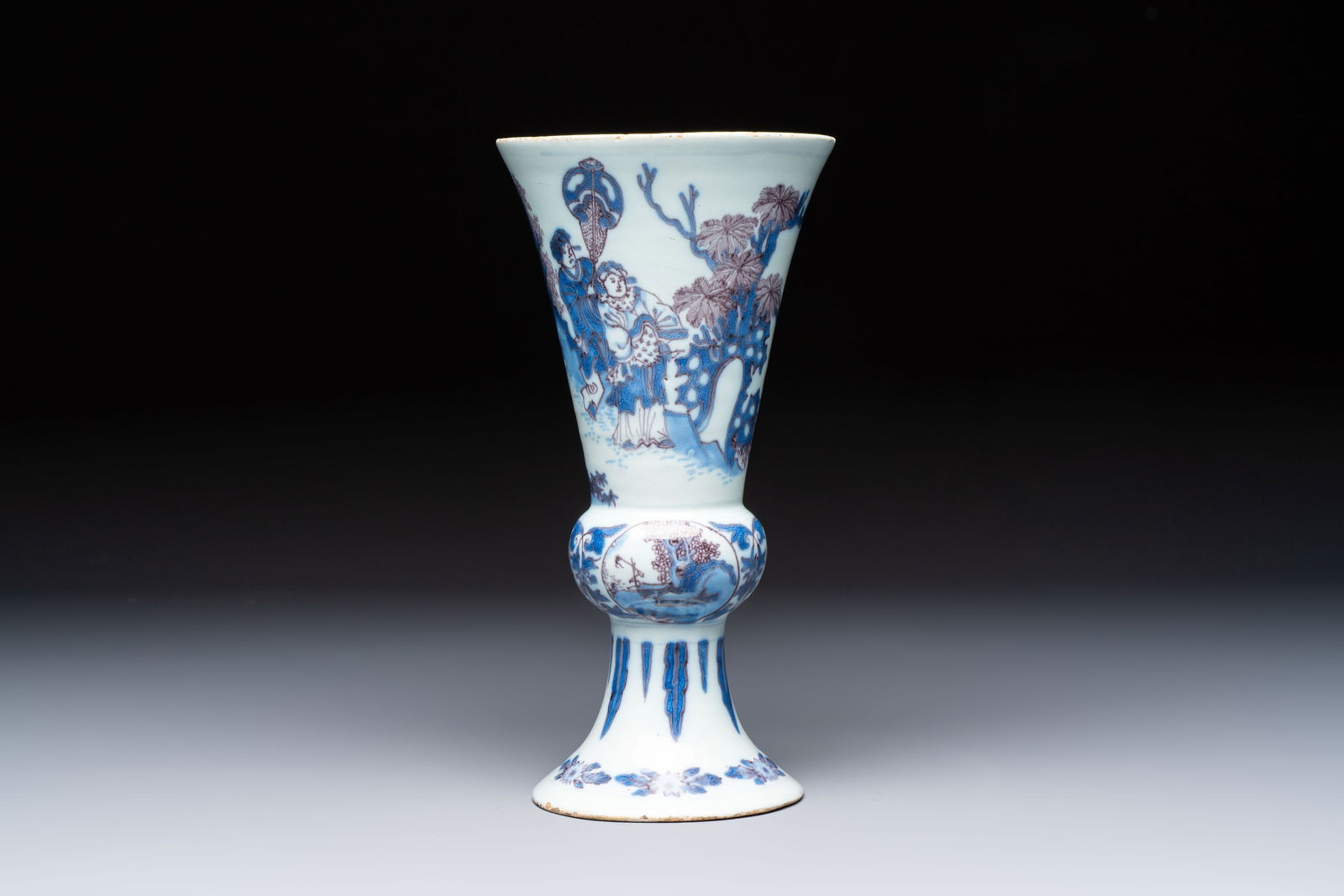 An extremely rare blue, white and manganese Dutch Delft chinoiserie beaker vase after a silver: An extremely rare blue, white and manganese Dutch Delft chinoiserie beaker vase after a silver model, late 17th C. H.: 24,6 cm An illegible mark to the base, attributed to SVE for Samuel van Eenhoorn,