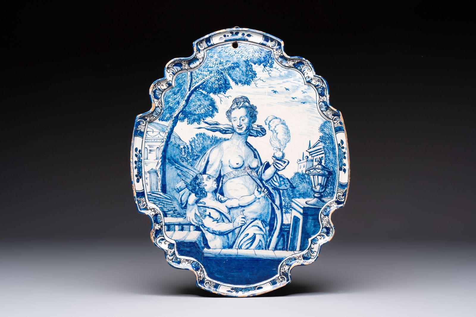 A fine blue and white Dutch Delft plaque with Venus and Amor, after an engraving by Hendrick (1 of 3)