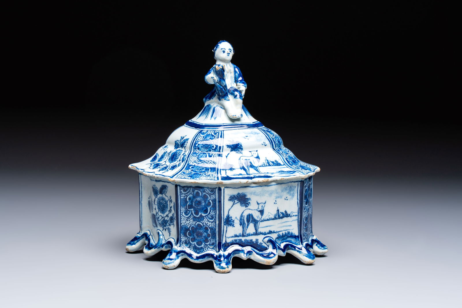 A blue and white Dutch Delft tobacco box and cover with a boy holding tobacco, 18th C. (1 of 7)