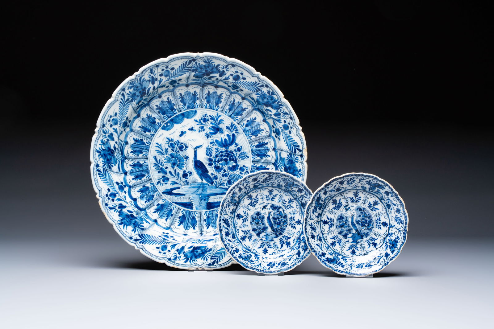 A pair of blue and white Dutch Delft 'Cranes' plates and a dish, 18th C. (1 of 5)