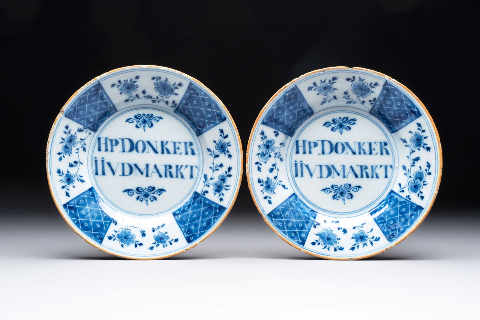 A pair of blue and white Dutch Delft inscribed plates, 18th C. (1 of 2)