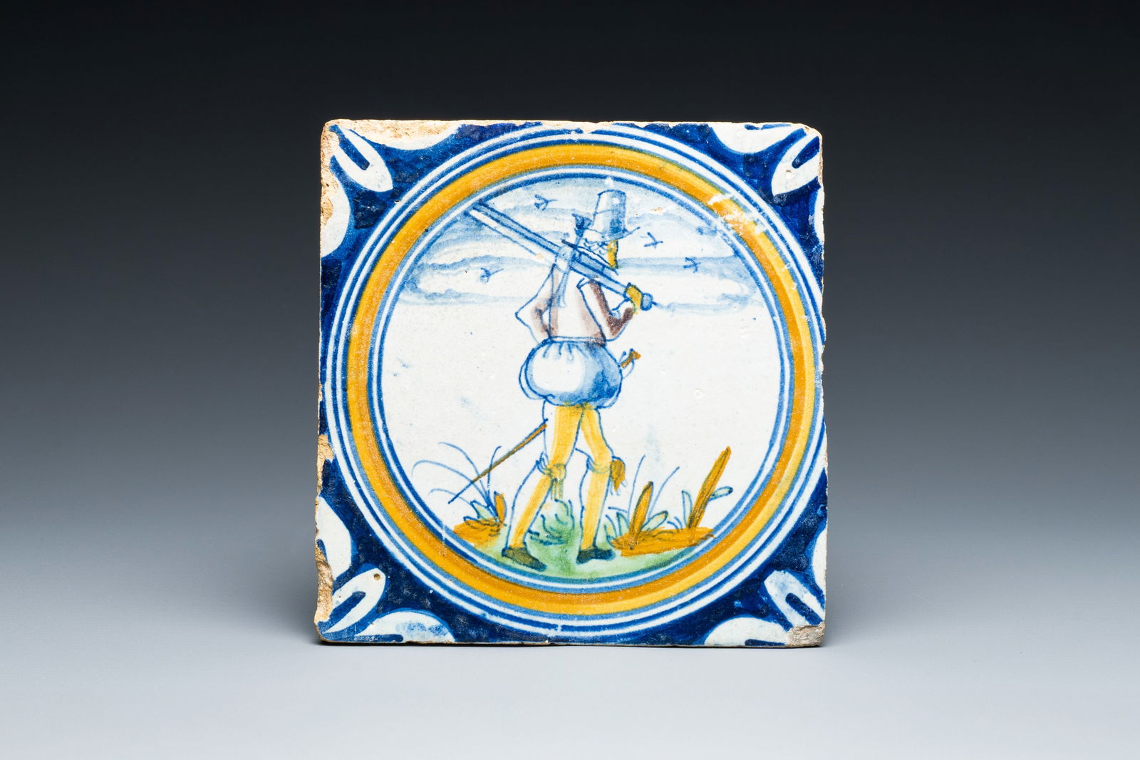 A polychrome Dutch Delft maiolica 'Soldier' medallion tile, 16th C. (1 of 2)