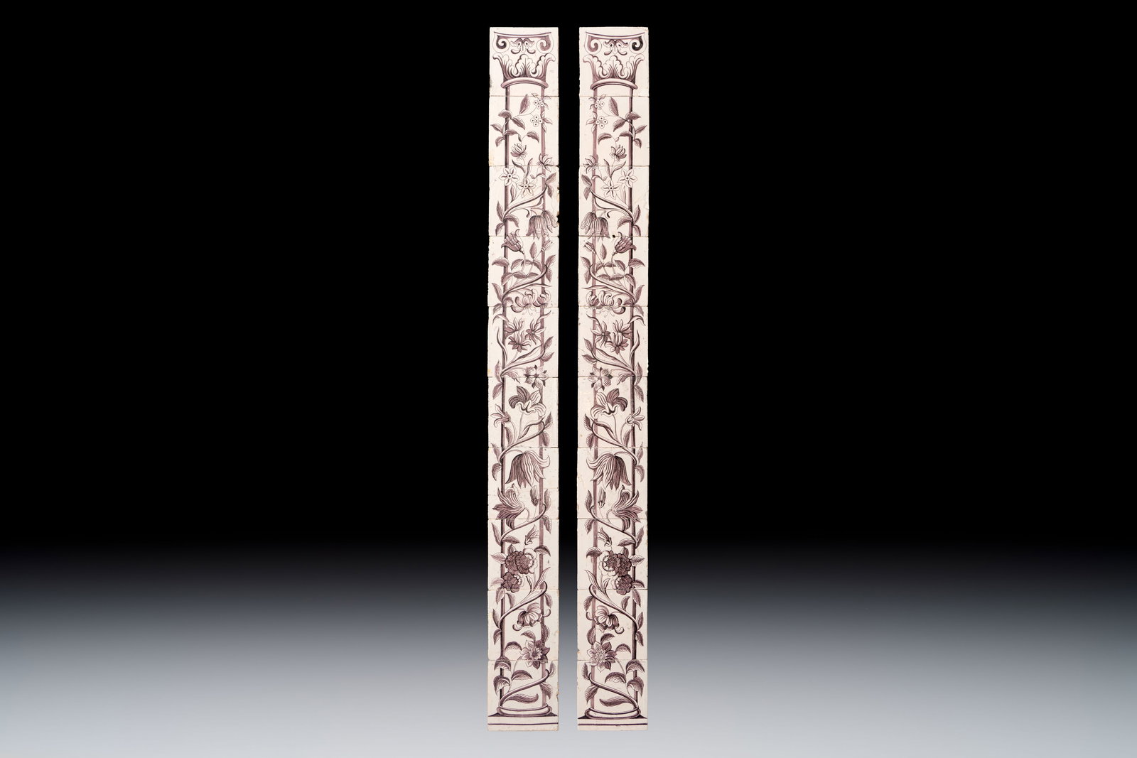 A pair of manganese Dutch Delft 10-piece tile pillars, 18th C. (1 of 2)
