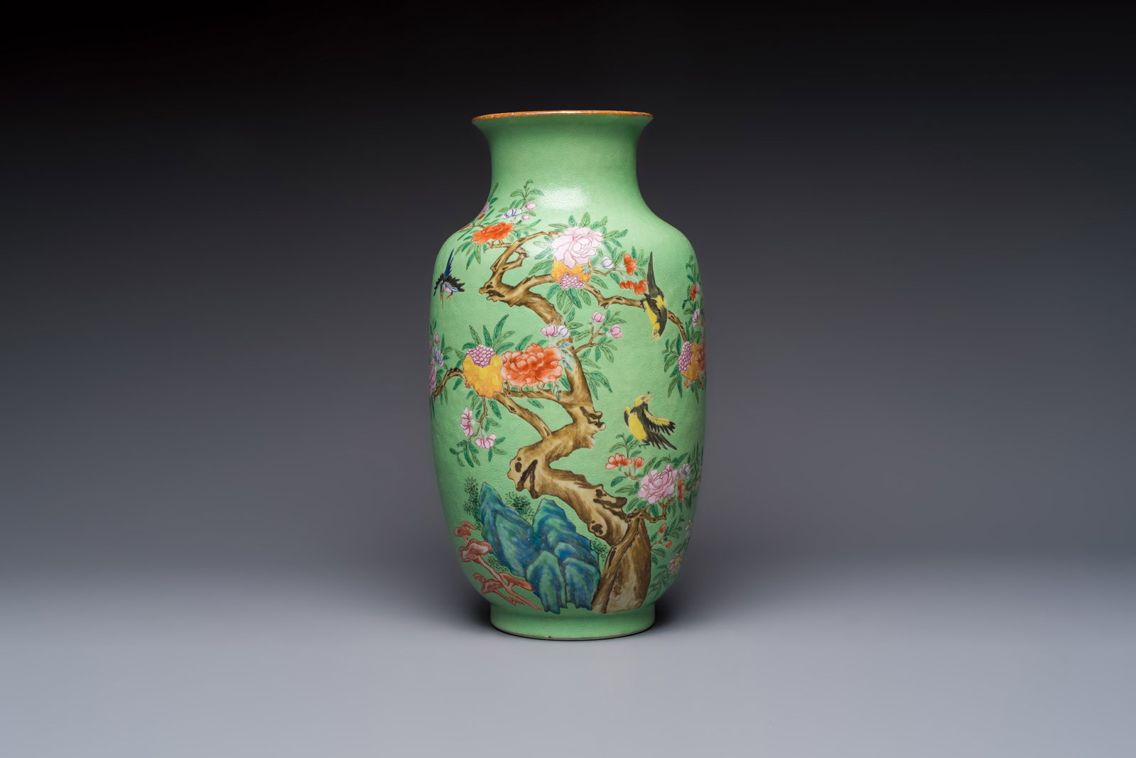 A Chinese famille rose sgraffiato lime-green-ground 'Birds among Flowering Branches' vase, Qianlong (1 of 6)