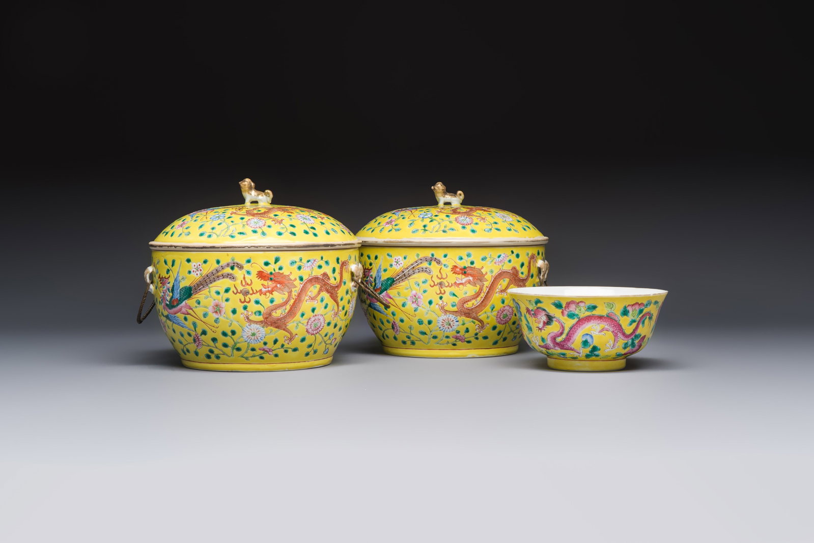 A pair of Chinese famille rose yellow-ground 'Dragon and Phoenix' covered warming bowls and a bowl, (1 of 19)