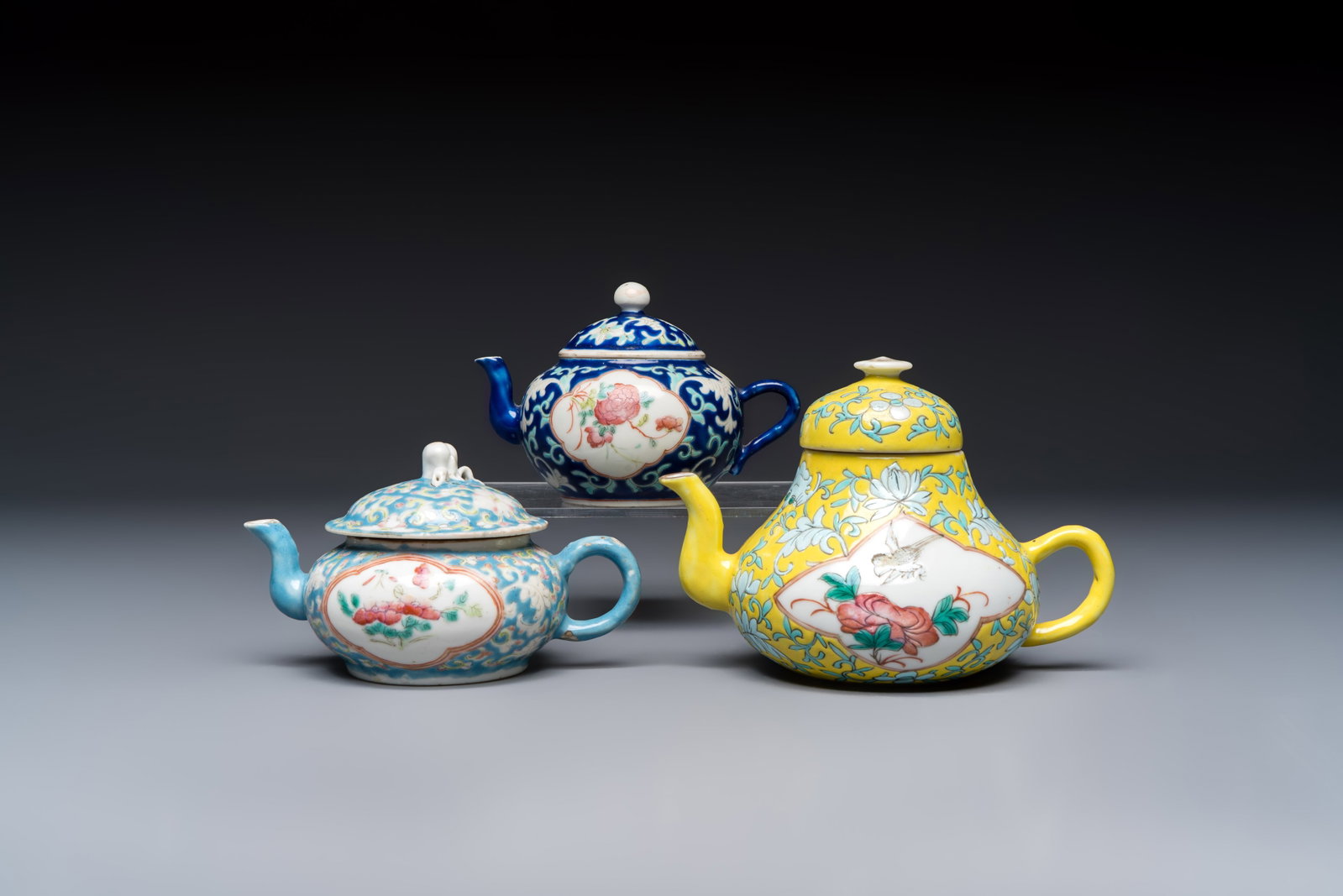 Three Chinese famille rose blue- and yellow-ground teapots and covers for the Straits or Peranakan (1 of 19)