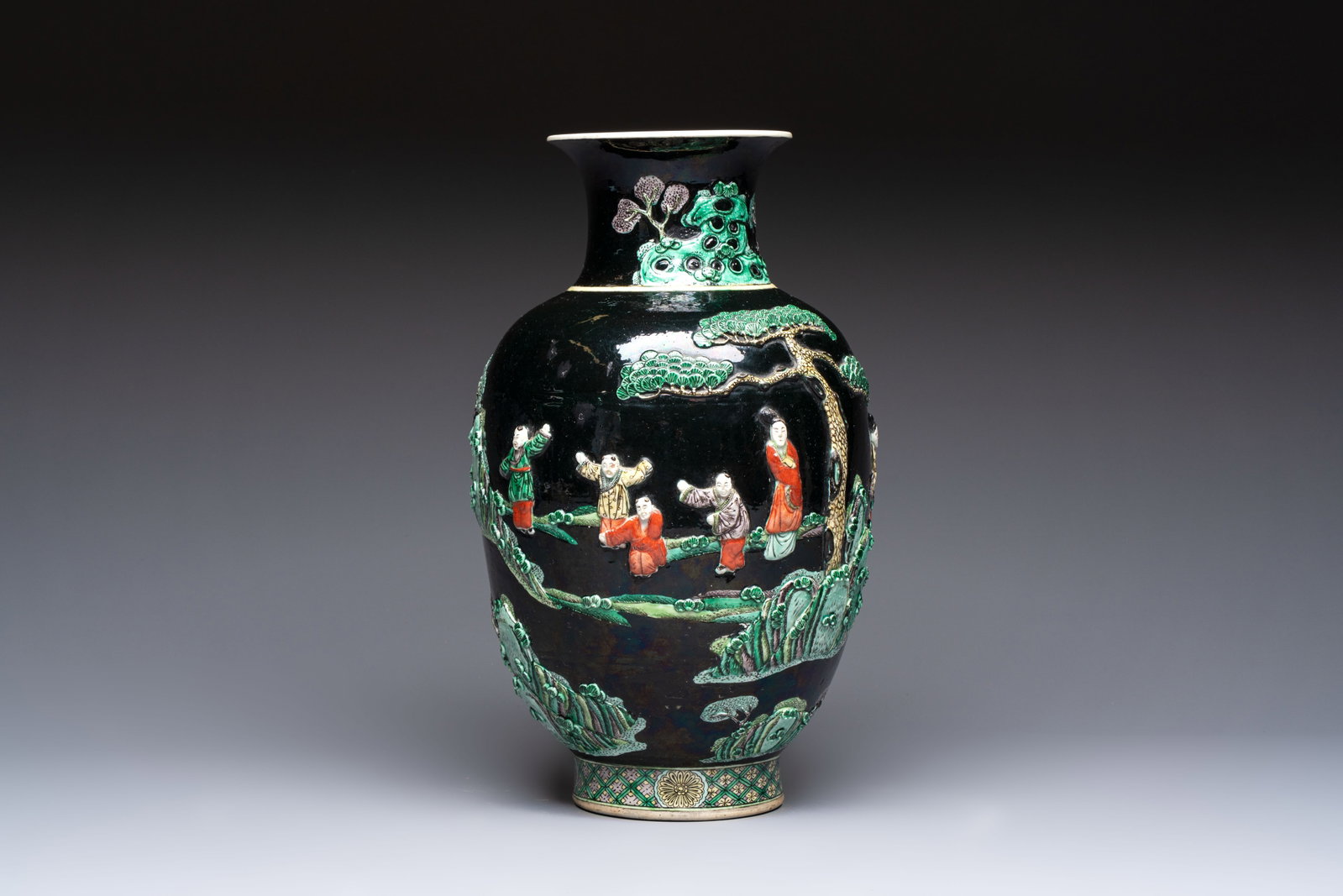 An unusual Chinese famille noire vase with relief design, Kangxi mark, 19th C.: An unusual Chinese famille noire vase with relief design, Kangxi mark, 19th C. H.: 36,2 cm