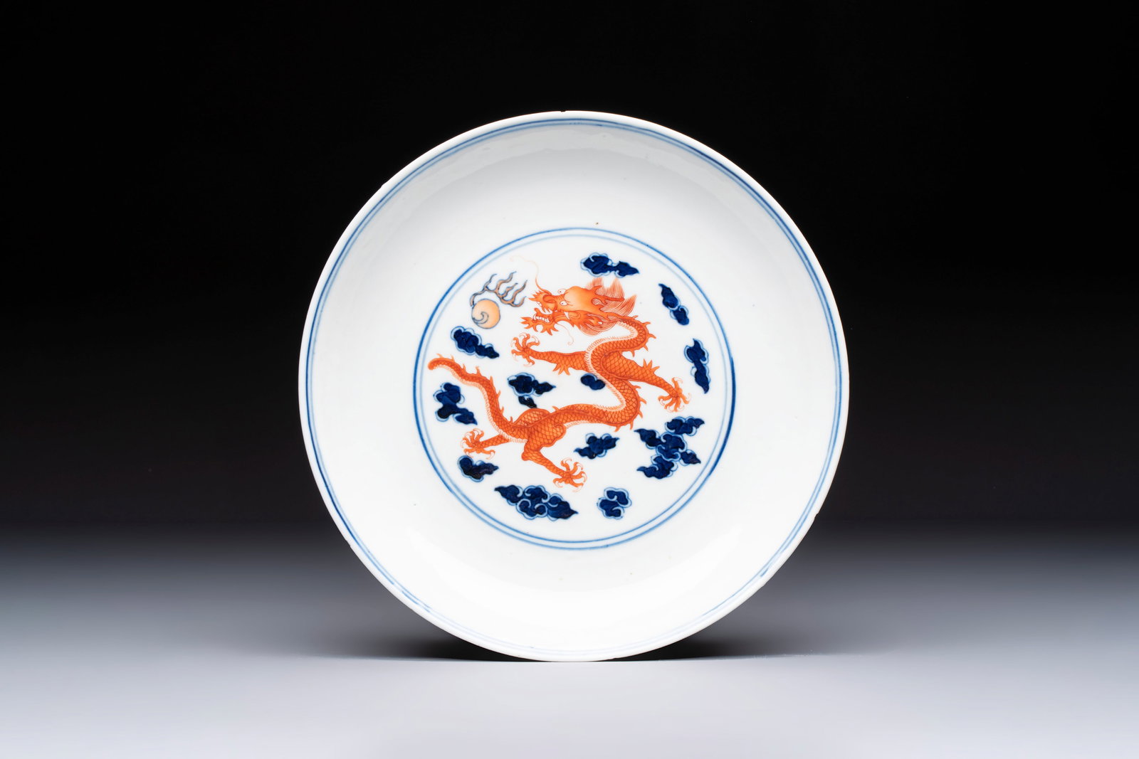 A Chinese blue and white iron-red-decorated 'Dragon' plate, Jing Jin Tang mark, 19th C. (1 of 2)