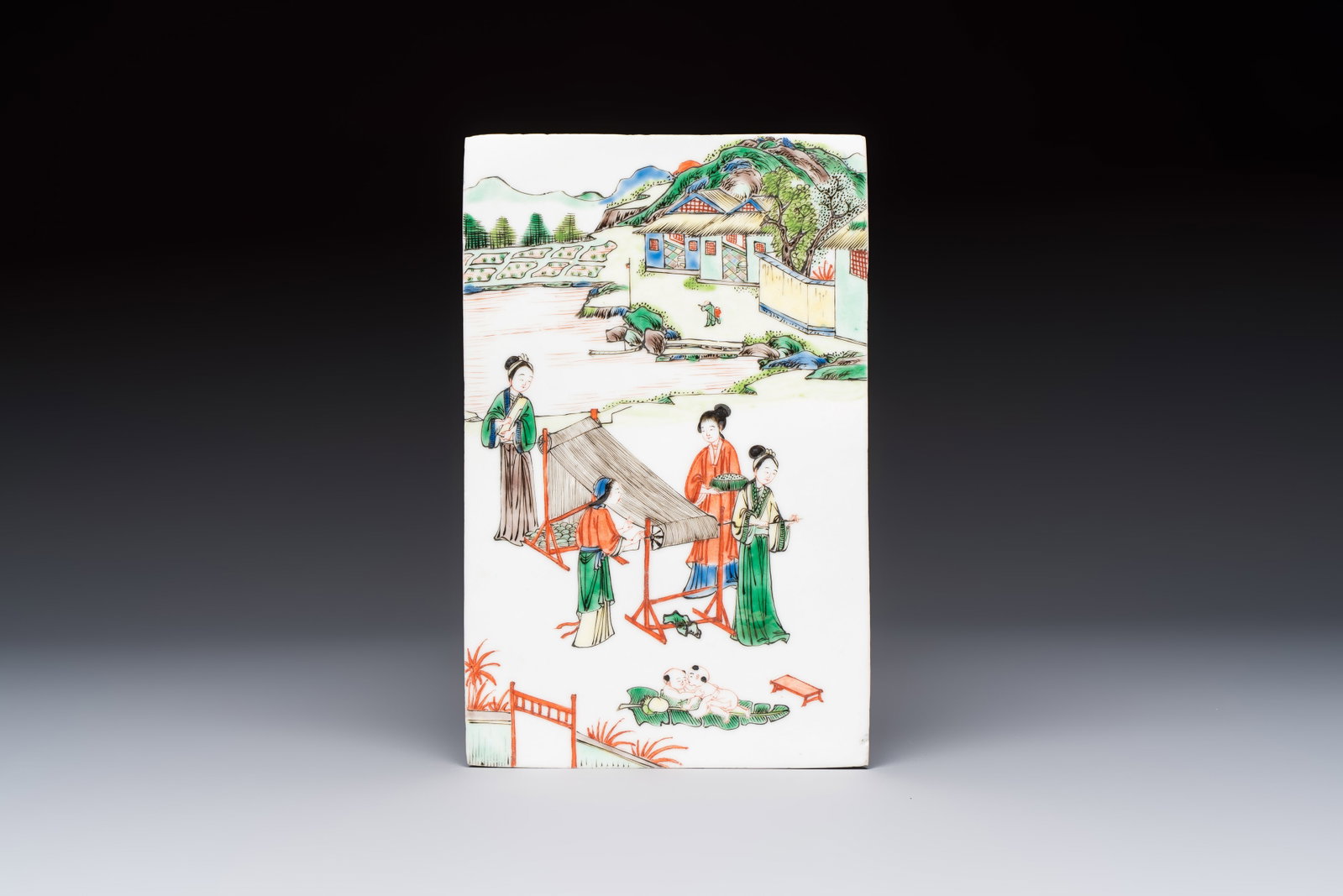 A Chinese famille verte 'Rice and Silk Production' plaque, 19th C. (1 of 2)