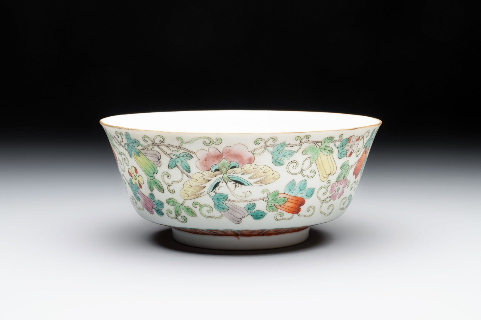 A Chinese famille rose 'Butterflies and Melons' bowl, Chenghua mark, 19th C. (1 of 6)