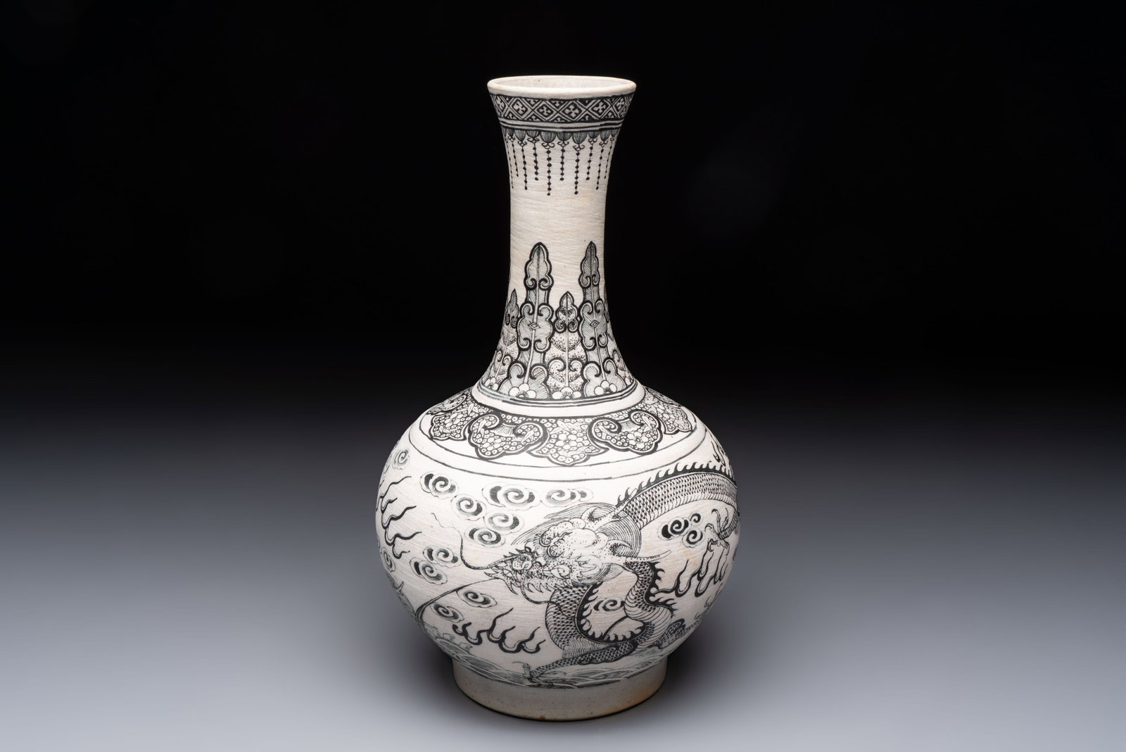 A Chinese black-enamelled biscuit 'Dragon' vase, Kangxi mark, 19th C. (1 of 6)