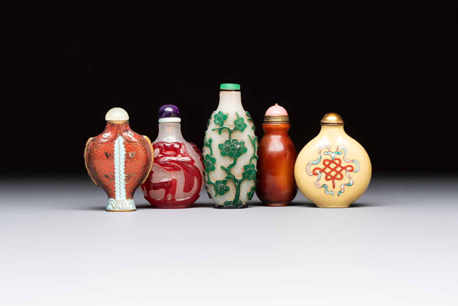 Five various Chinese cloisonné, glass, horn and enamel snuff bottles, Qianlong mark, 19/20th C. (1 of 7)