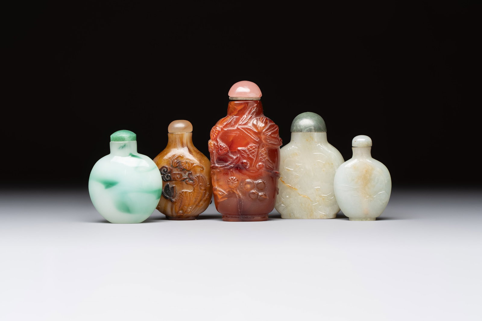 Five various Chinese jade, jadeite, agate and glass snuff bottles, 19th C. (1 of 7)