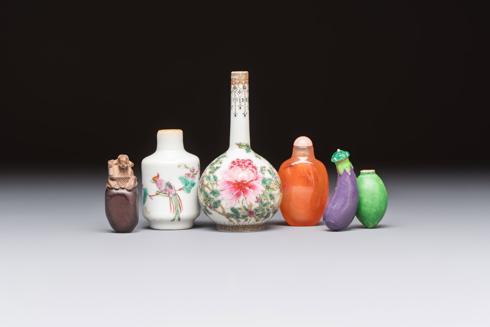 A group of four Chinese porcelain and agate snuff bottles, a miniature vase and a carved seed, (1 of 7)