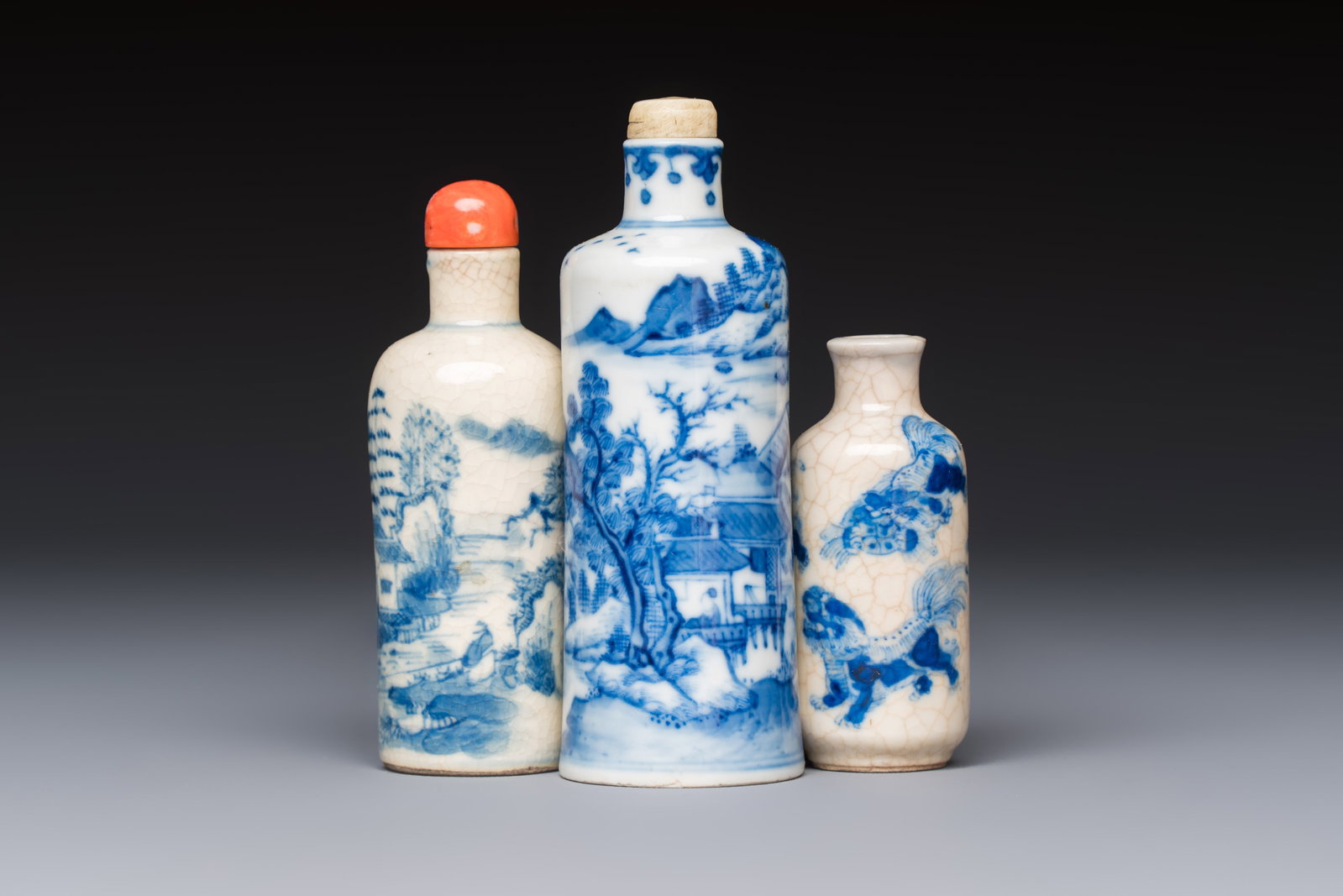 Three Chinese blue and white snuff bottles with landscapes and 'Buddhist Lions', Yongzheng marks, (1 of 7)