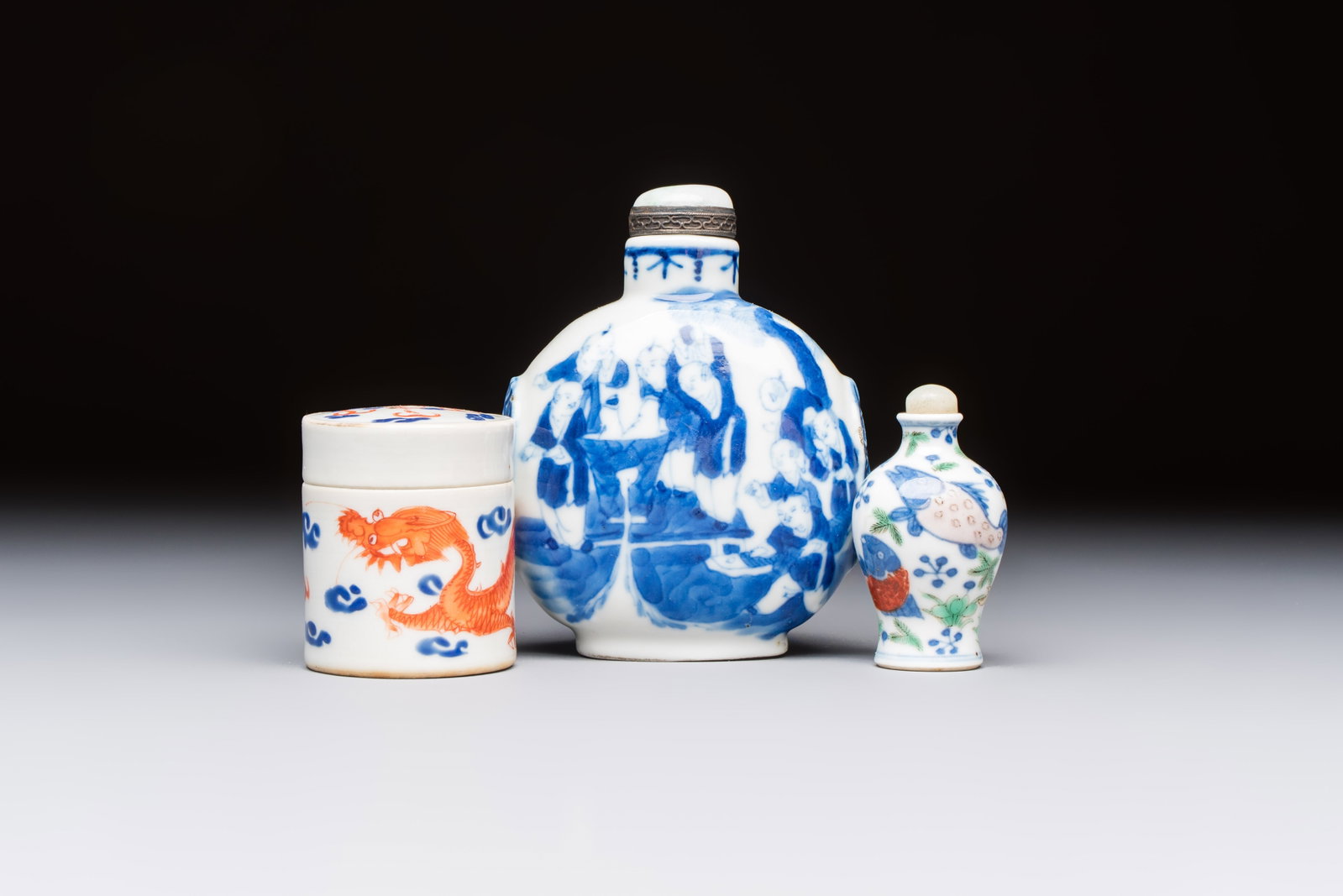 A Chinese iron-red 'Dragon' covered box, a blue and white '100 Boys' and a famille verte 'Fish' (1 of 7)
