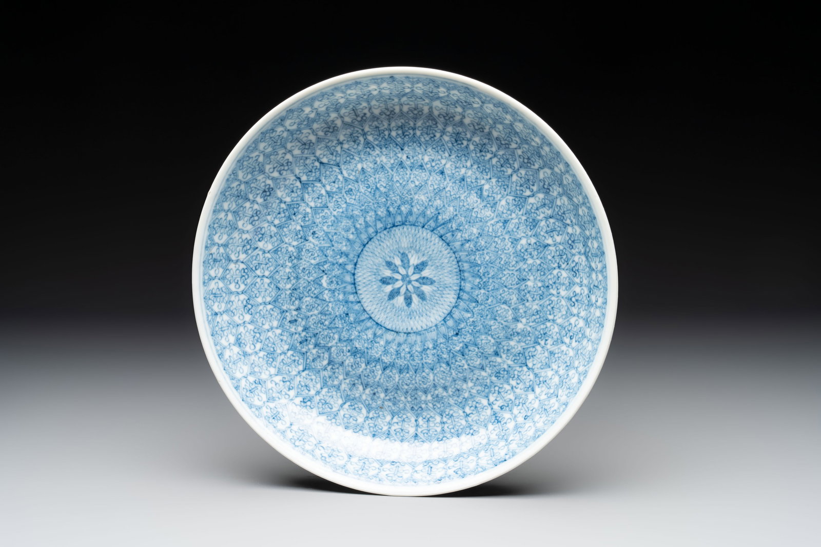 A Chinese blue and white plate with stylised floral design, Guangxu mark and of the period (1 of 2)