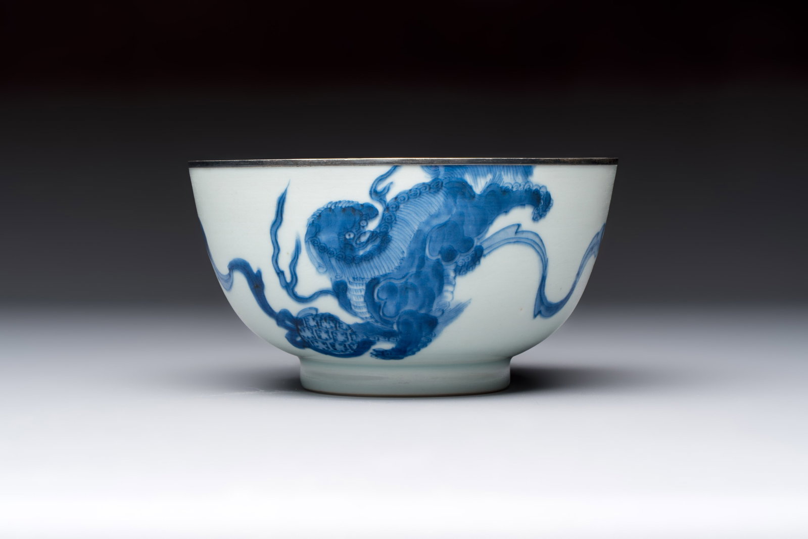 A Chinese blue and white 'Bleu de Hue' bowl with mythical beasts, Nguyen mark, 19th C. (1 of 7)