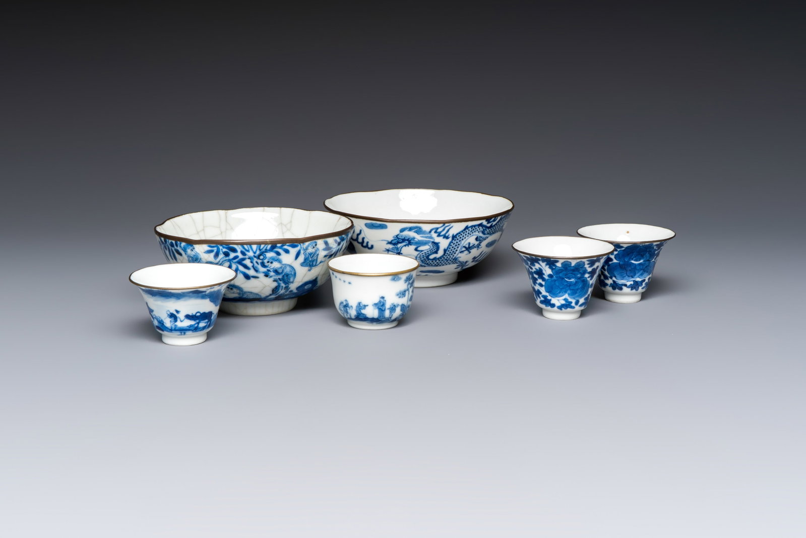 Four Chinese blue and white 'Bleu de Hue' cups and two bowls, various marks, 19th C. (1 of 19)