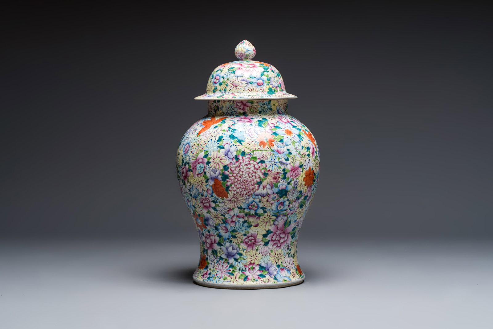 A large Chinese famille rose 'Millefleurs' baluster vase and cover, Yongzheng mark, Republic: A large Chinese famille rose 'Millefleurs' baluster vase and cover, Yongzheng mark, Republic H.: 63,5 cm (incl. cover)