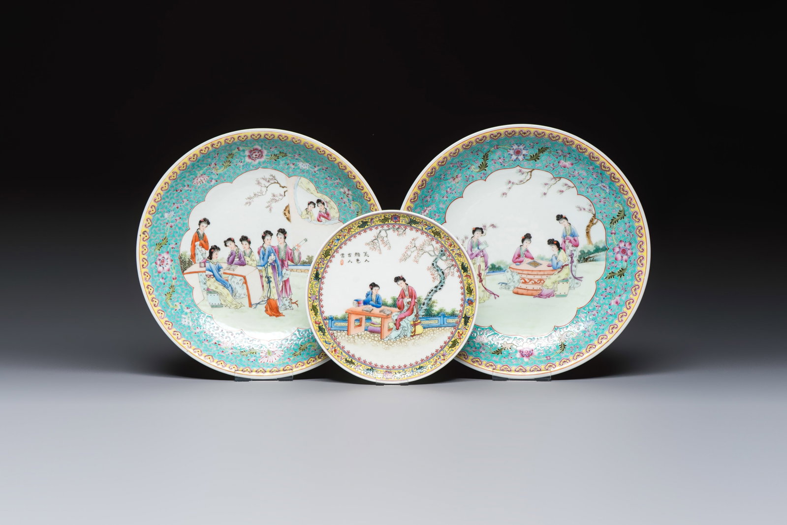 Two Chinese famille rose dishes and a plate with elegant beauties, Qianlong marks, 20th C: Two Chinese famille rose dishes and a plate with elegant beauties, Qianlong marks, 20th C Dia.: 33,5 cm (the dishes) Dia.: 22,5 cm (the plate)