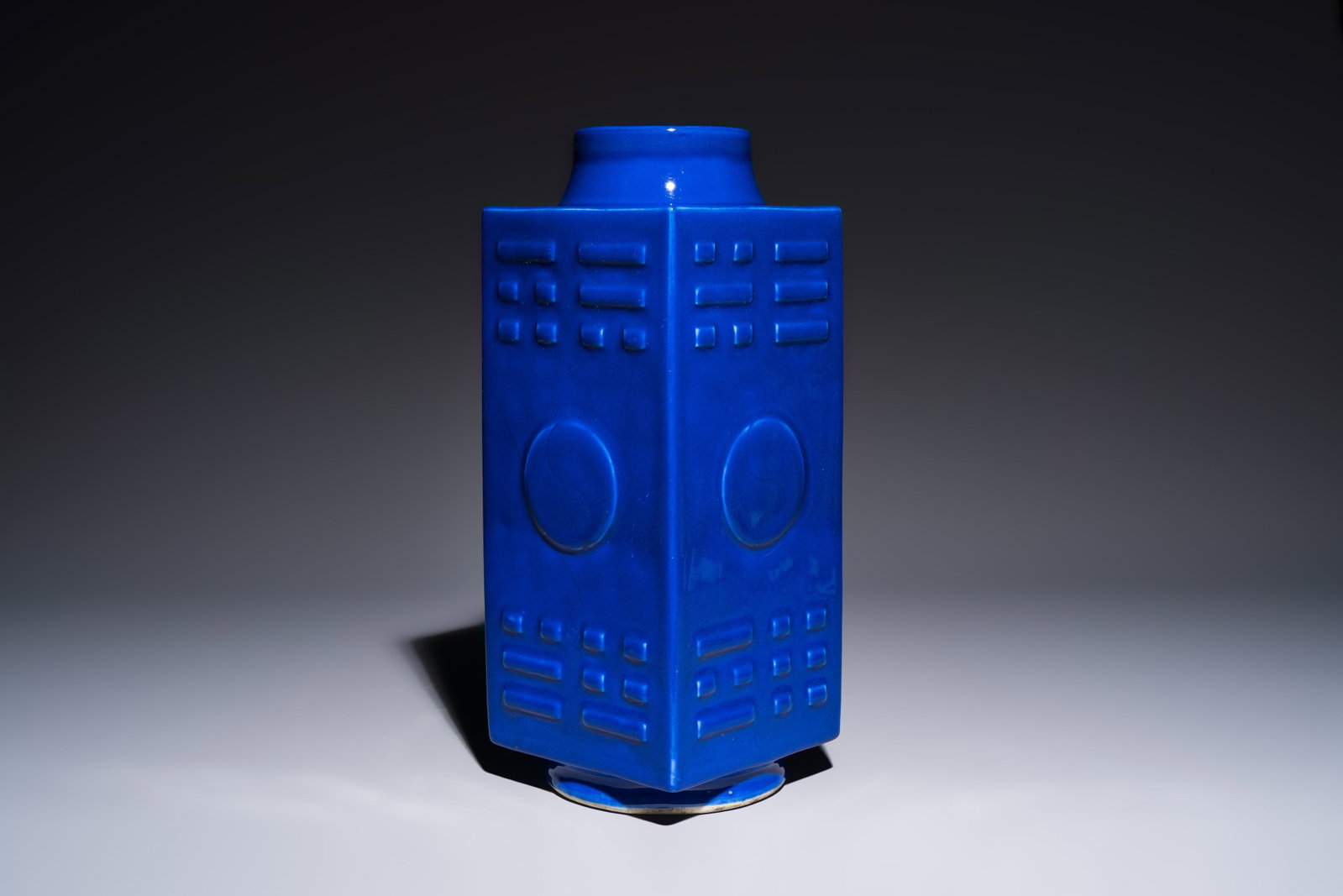 A large Chinese blue-glazed 'Cong' vase with trigrams, 19th C. (1 of 10)
