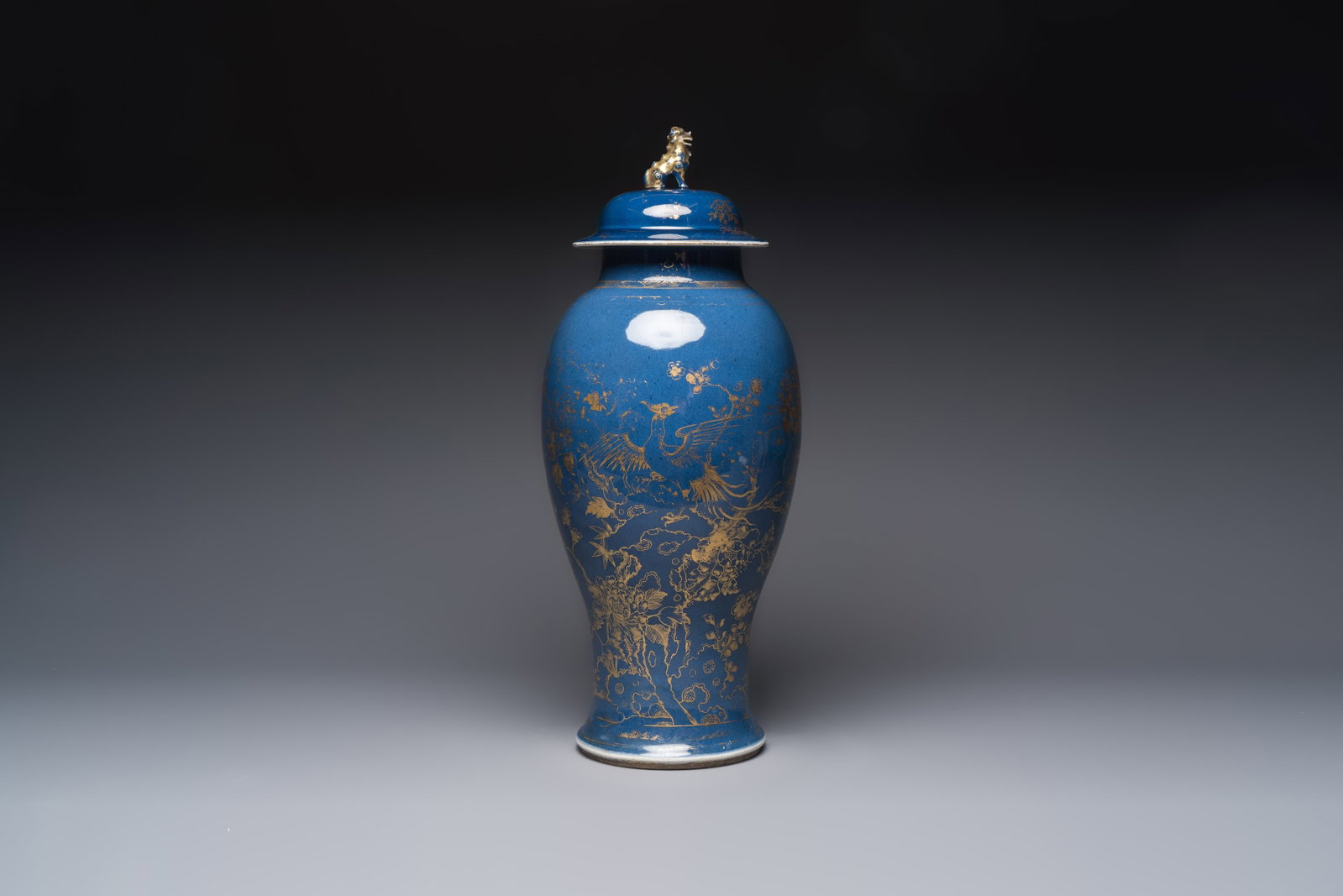 A Chinese gilt-decorated powder-blue-ground 'Phoenix among Blossoming Branches' vase, Qianlong (1 of 6)