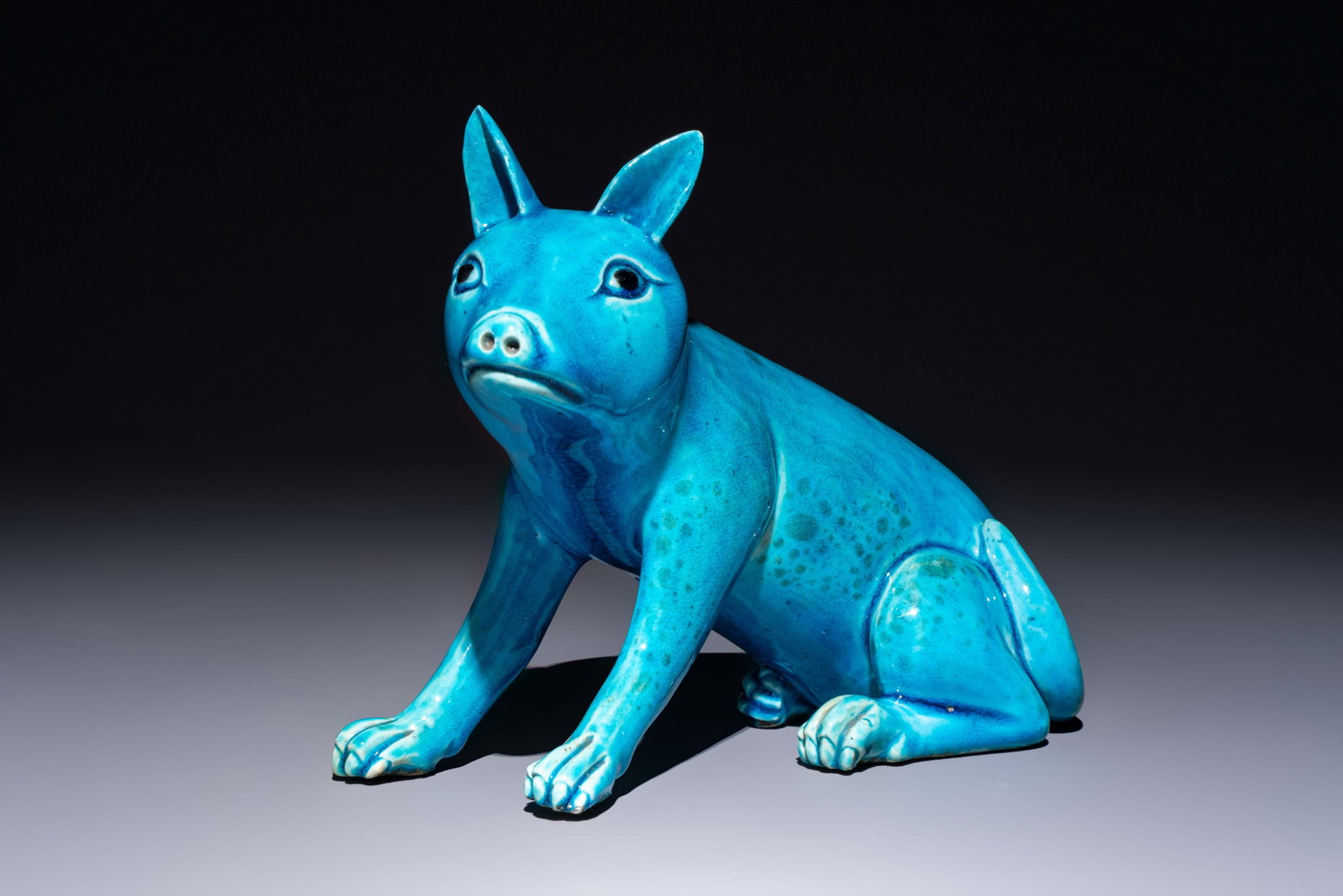 A Chinese turquoise-glazed model of a dog, Qianlong mark, 19th C.: A Chinese turquoise-glazed model of a dog, Qianlong mark, 19th C. L.: 19 cm - H.: 16 cm