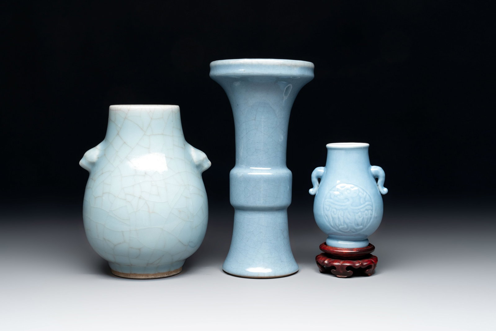 Three Chinese claire-de-lune vases, one with a wooden stand, Yongzheng mark, 19/20th C. (1 of 6)