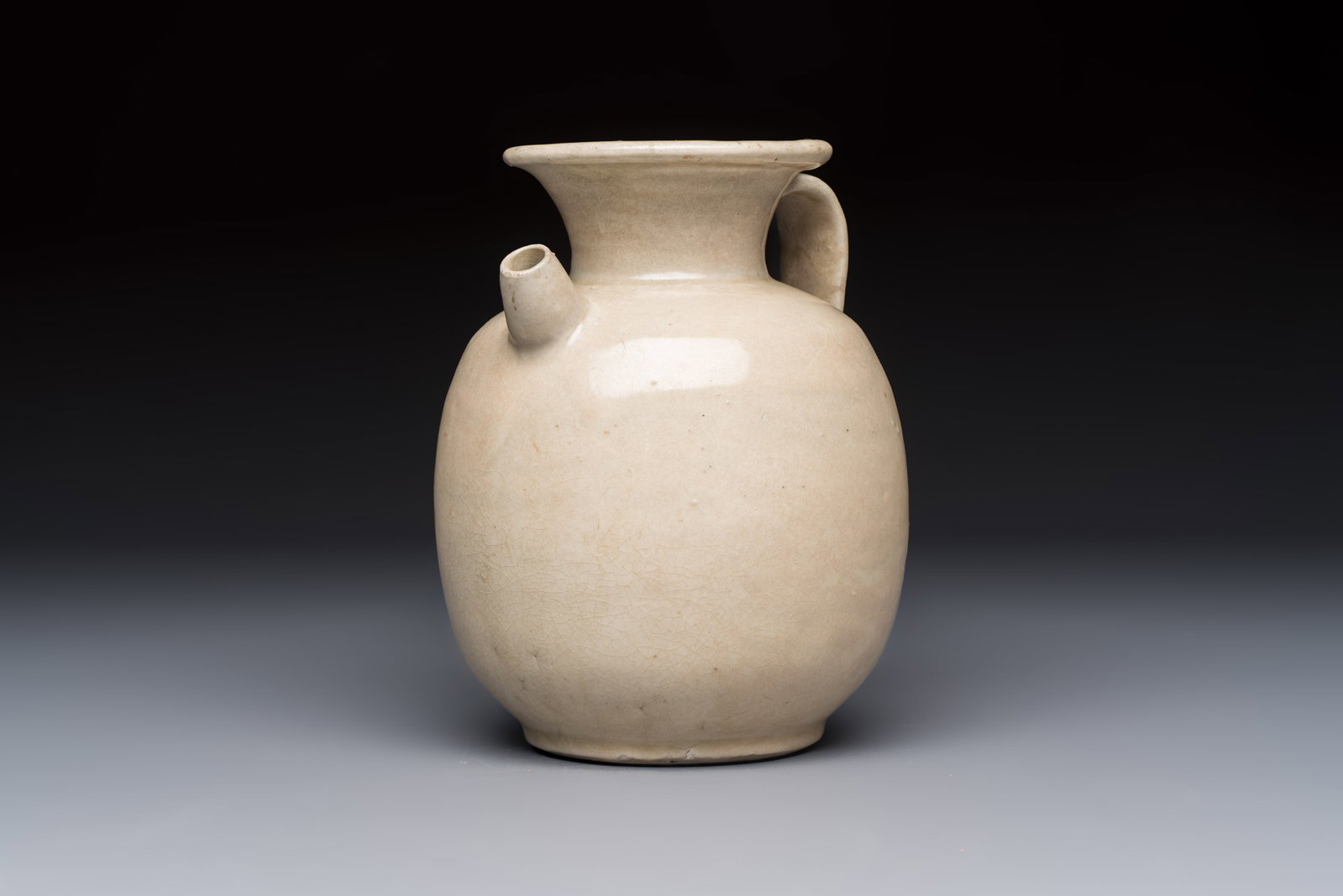 A Chinese cream-glazed ewer with a barrel-shaped body, Hebei/Henan provinces, Tang/Five Dynasties (1 of 9)