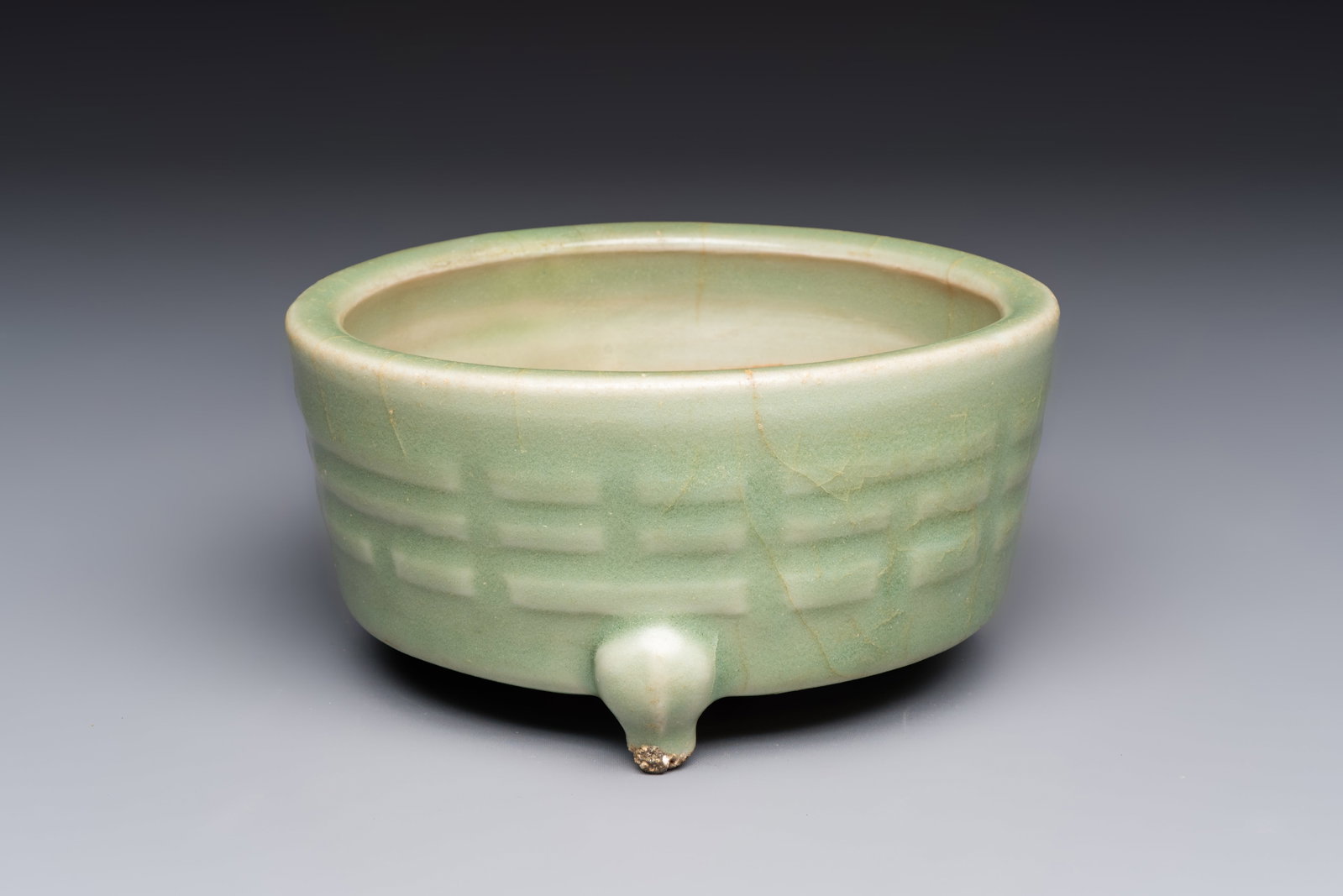 A Chinese Longquan celadon 'Bagua' tripod censer, Ming (1 of 7)
