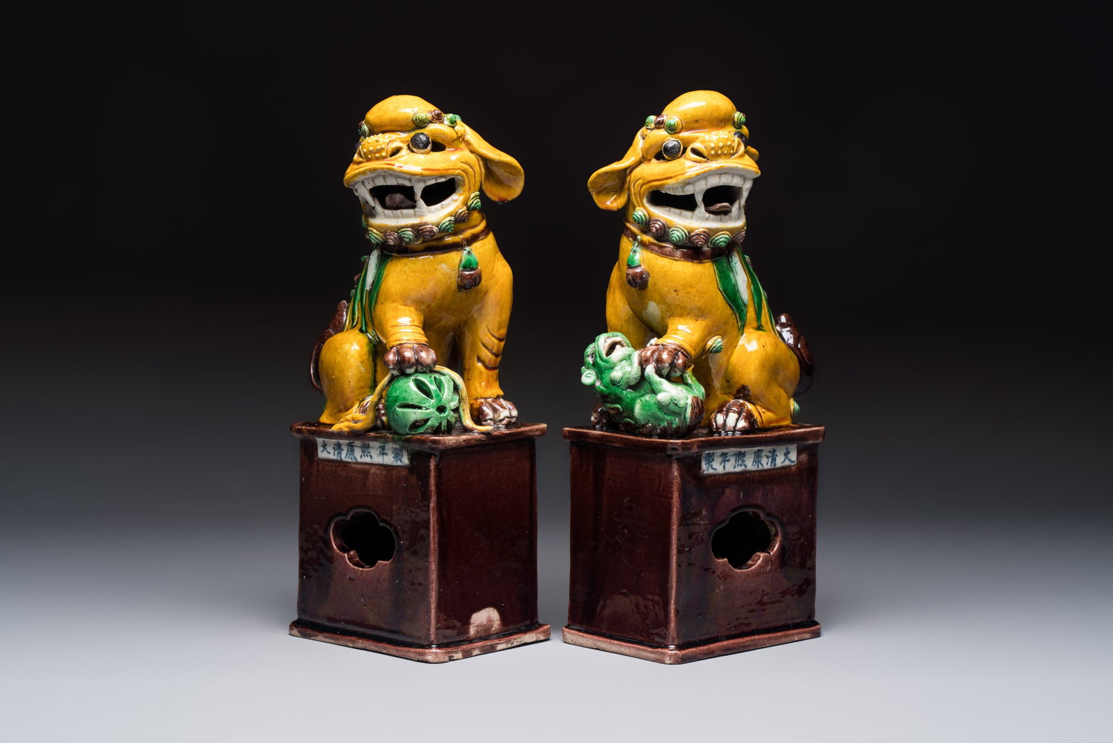 A pair of Chinese sancai-glazed Buddhist lions, Kangxi mark, 19th C. (1 of 7)