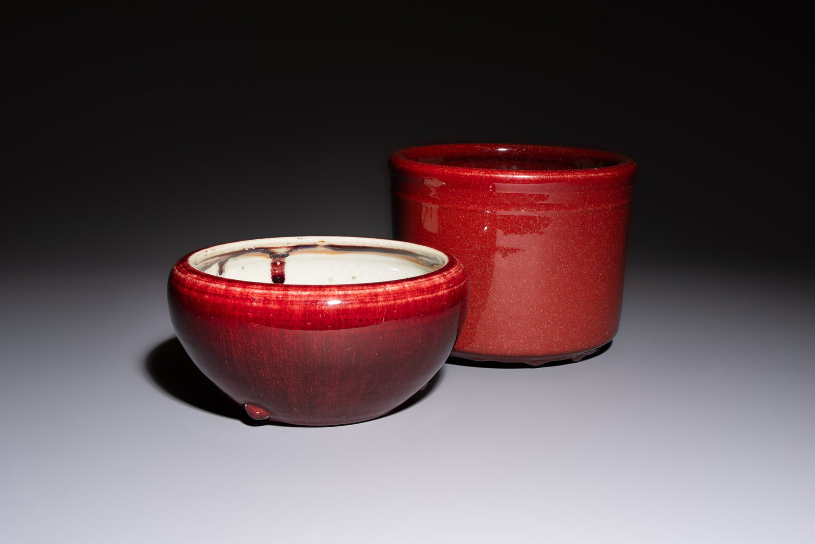 A Chinese flambé-glazed bowl and a tripod censer, 19th C.: A Chinese flambé-glazed bowl and a tripod censer, 19th C. Dia.: 20,2 cm - H.: 16,2 cm (the tripod censer) Dia.: 21,5 cm - H.: 10,8 cm (the bowl)