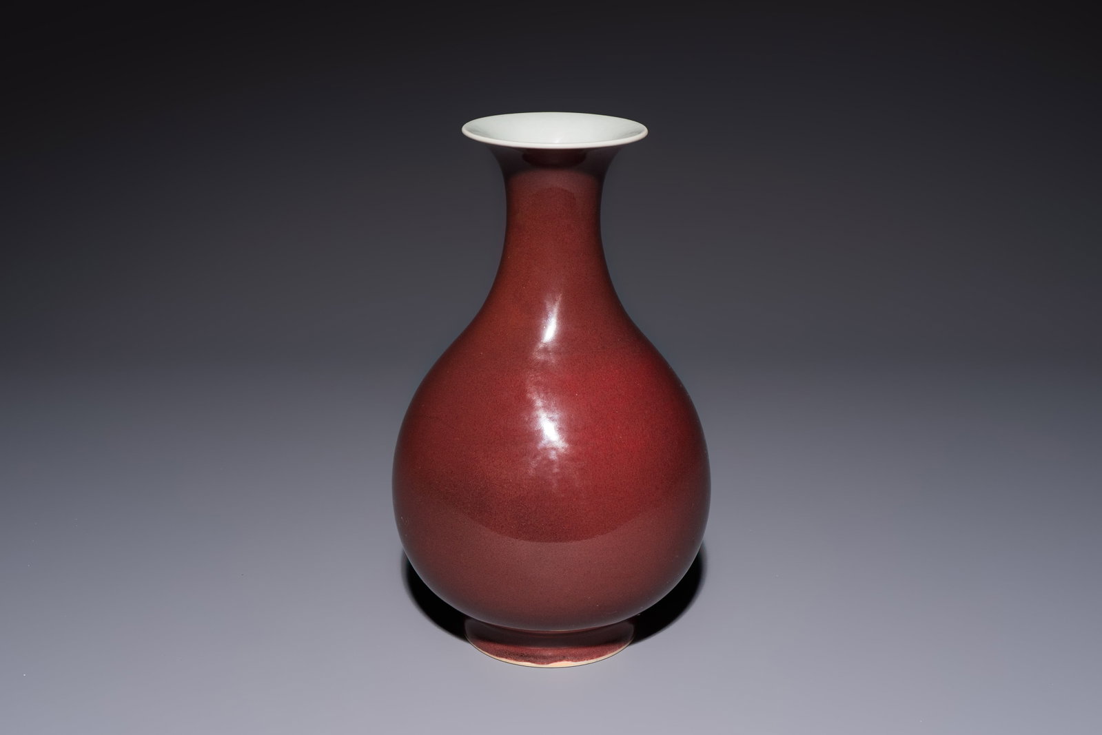 A Chinese copper-red-glazed 'Yuhuchunping' vase, Qianlong mark and of the period (1 of 8)