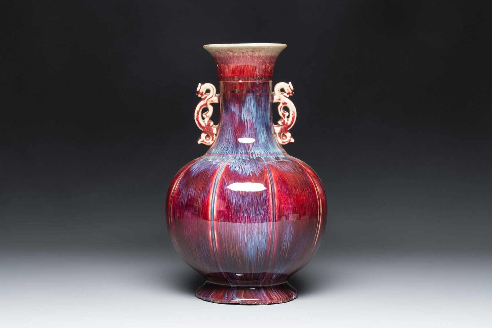 A Chinese flambé-glazed vase with 'chilong' handles, 20th C.: A Chinese flambé-glazed vase with 'chilong' handles, 20th C. H.: 34 cm