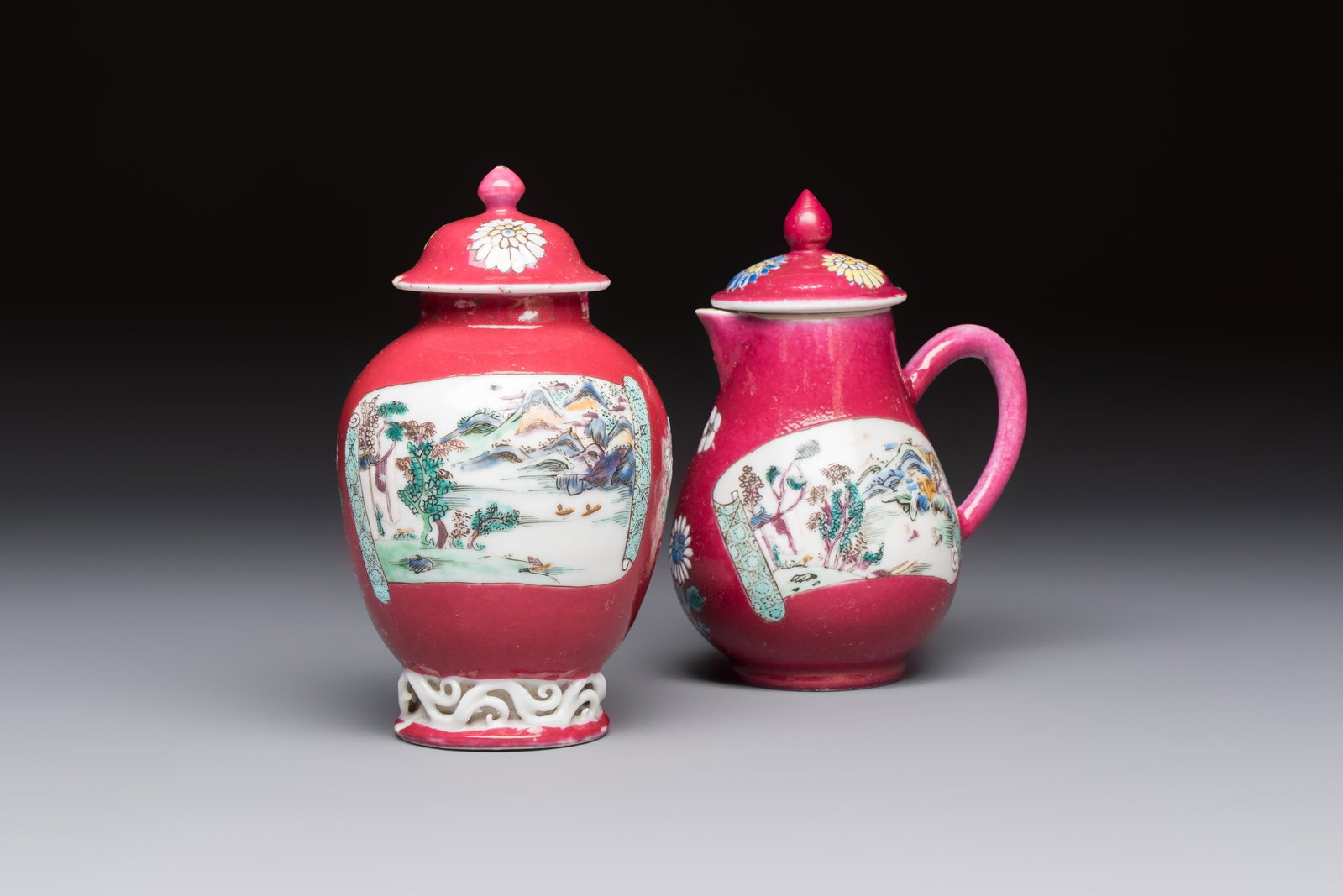 A Chinese famille rose ruby-ground 'Landscape Scroll' covered tea caddy and a covered milk jug, (1 of 7)