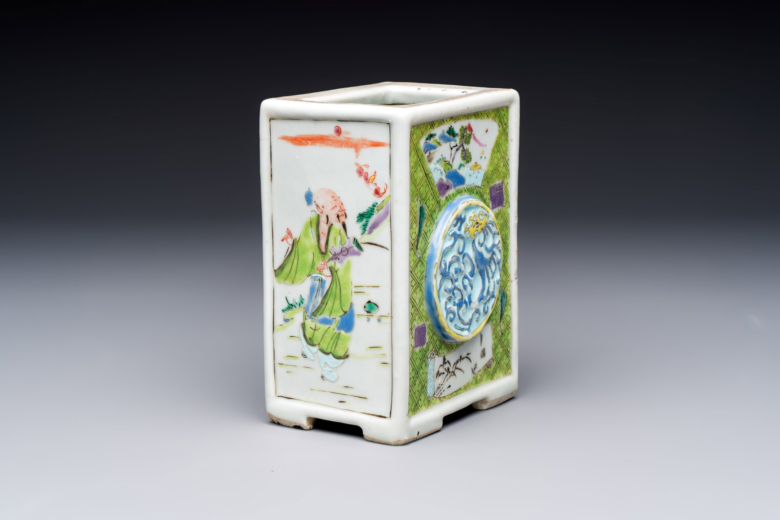 A Chinese famille rose relief-moulded rectangular brush pot with figural design, Yongzheng (1 of 8)