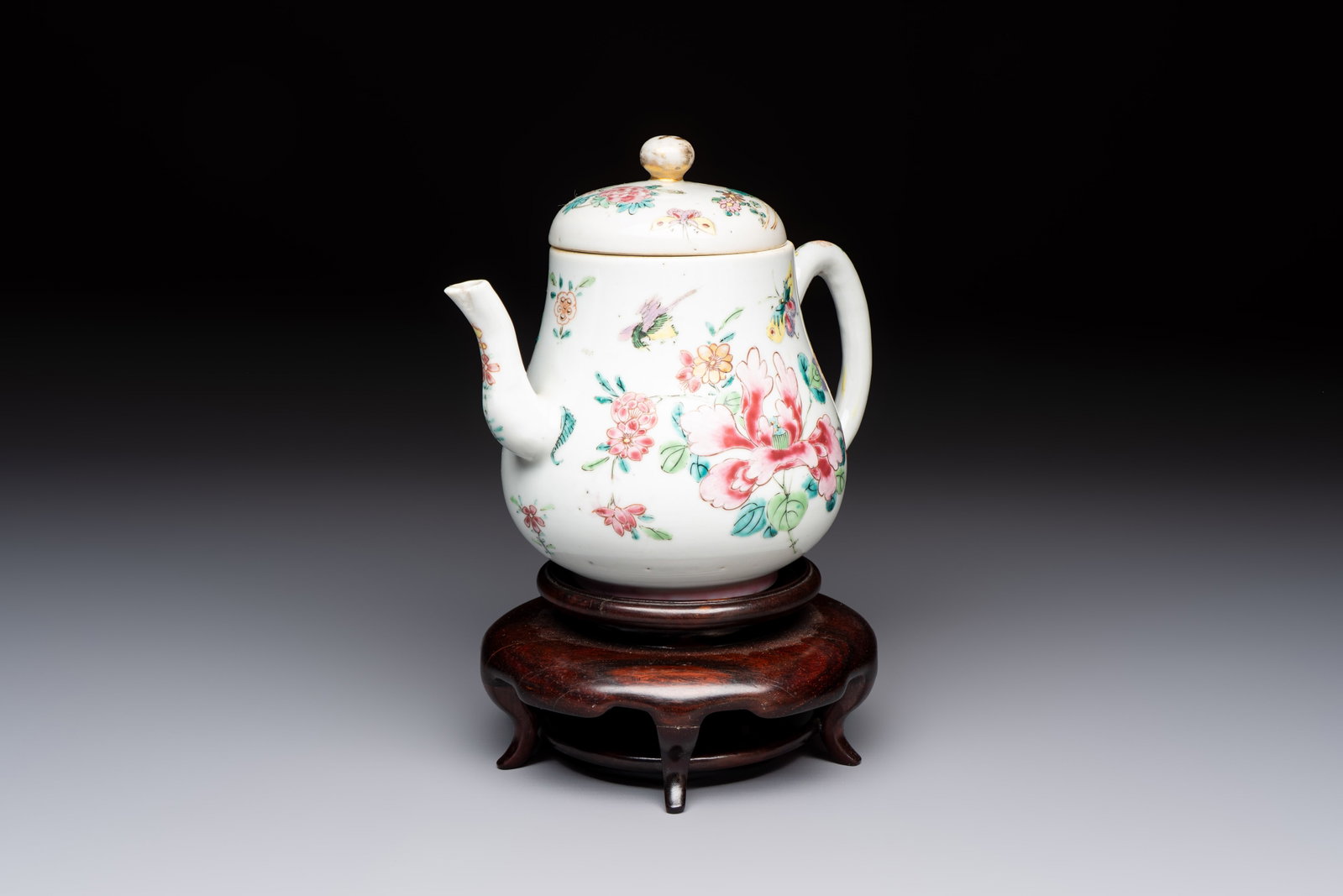 A Chinese famille rose 'Birds and Insects among Flowers' teapot on a later wooden stand, Yongzheng (1 of 9)