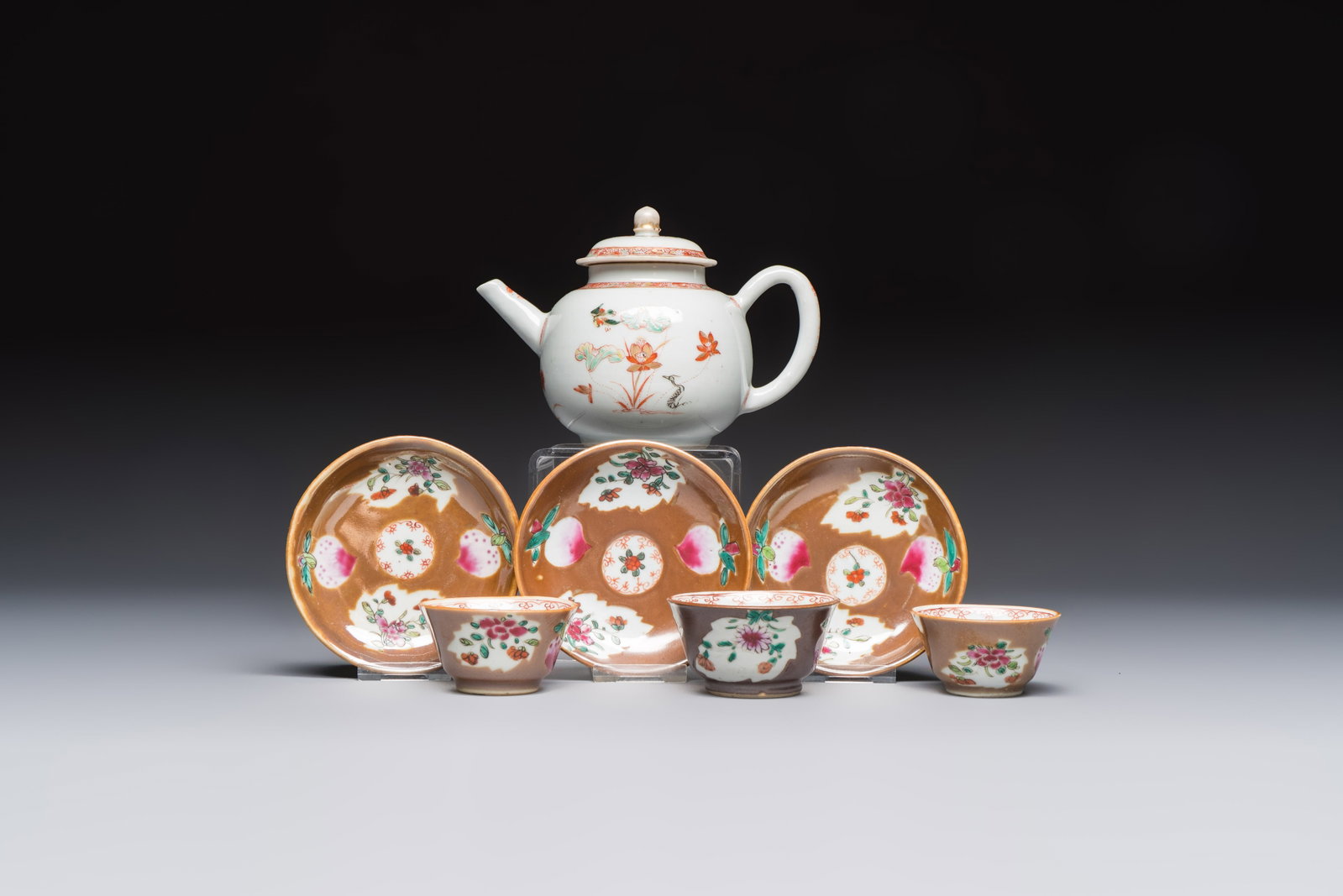A Chinese famille verte teapot and three famille rose capucine-ground cups and saucers, (1 of 15)