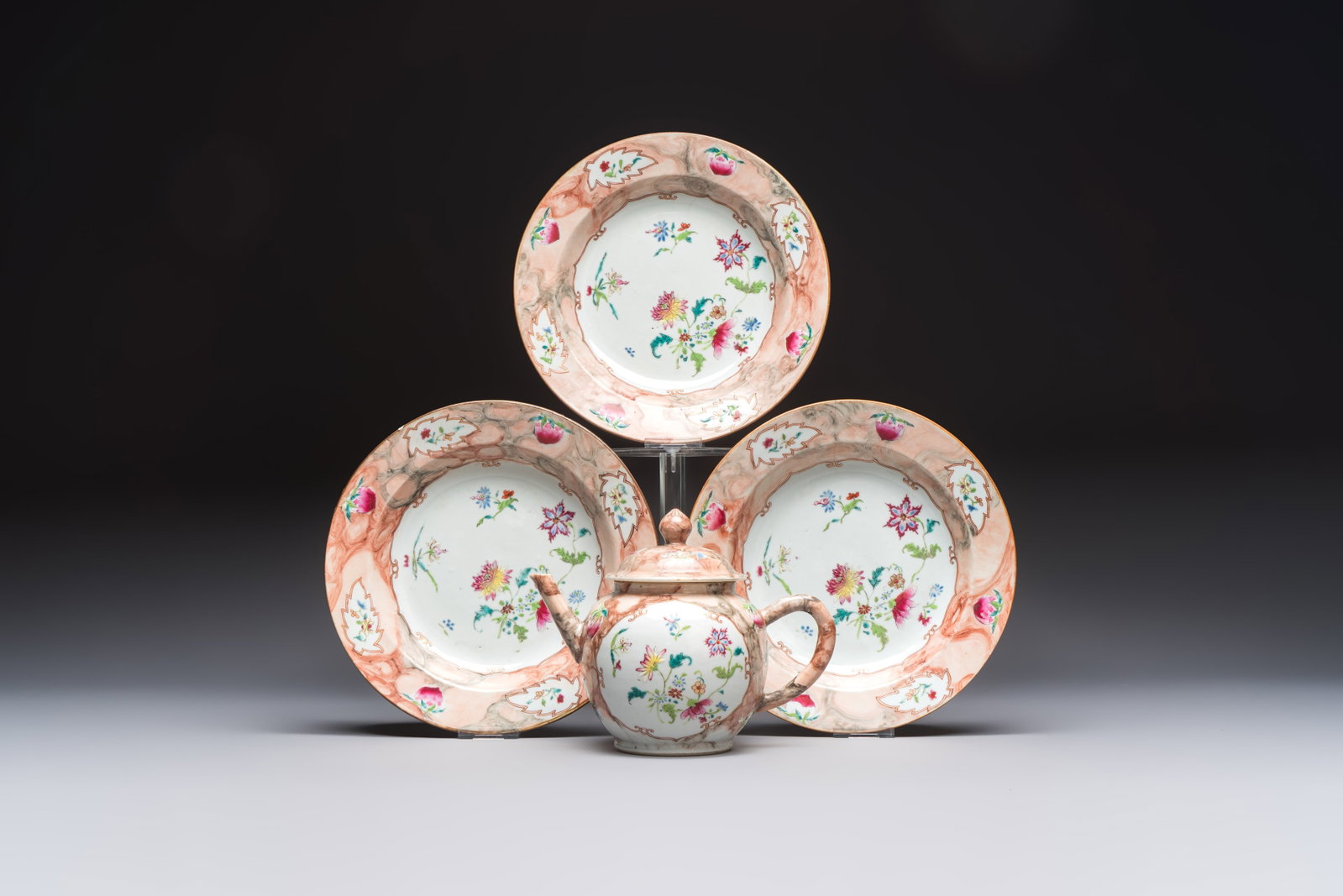 A Chinese famille rose 'Faux-Bois' teapot and three plates, Qianlong (1 of 9)
